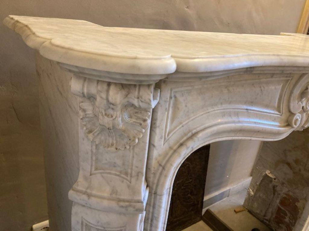 Carved Louis XV White Marble Fireplace Mantel For Sale