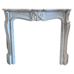Cheminée Louis XV en marbre blanc