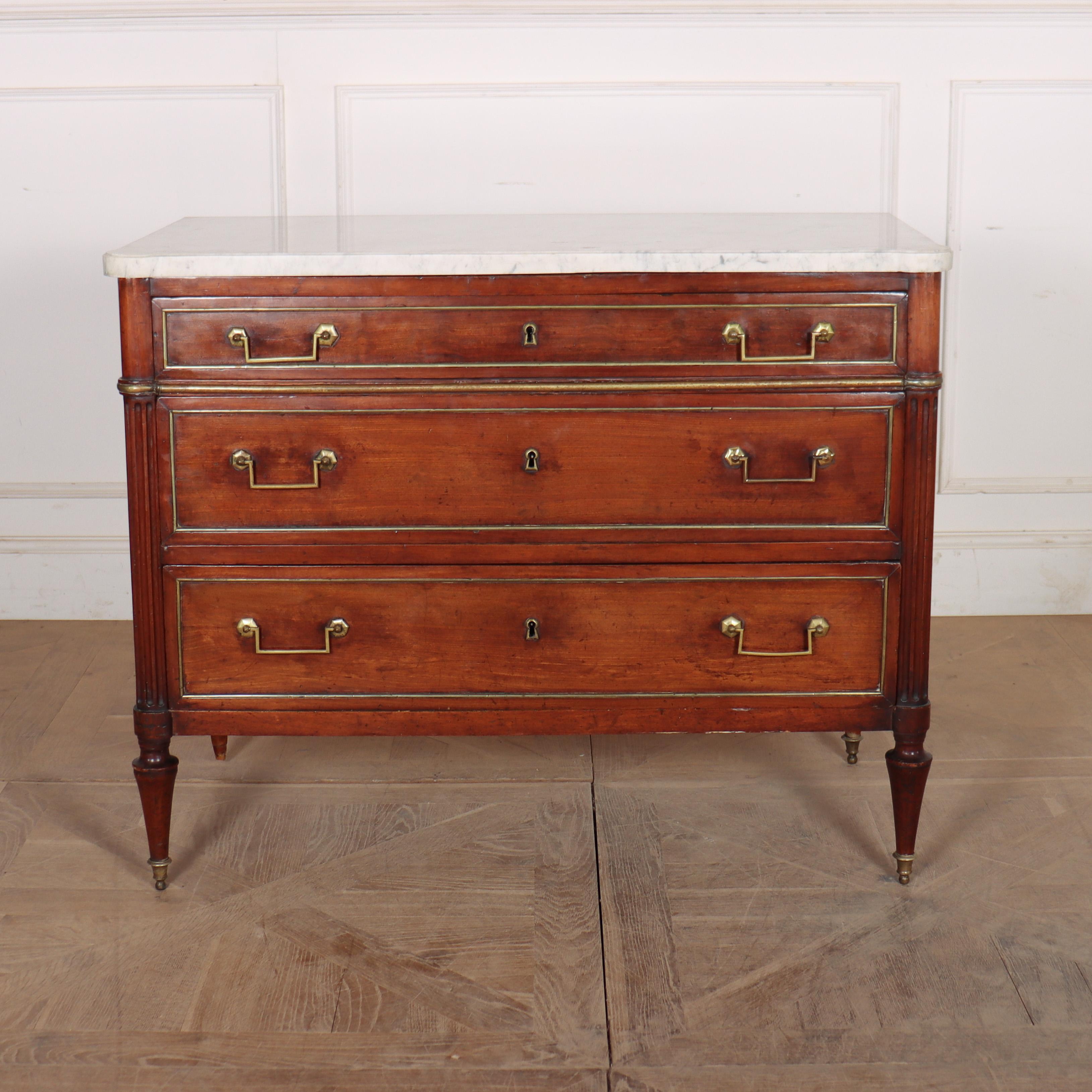 Late 18th Century French fruitwood 3 drawer commode with a thick marble top. 1790