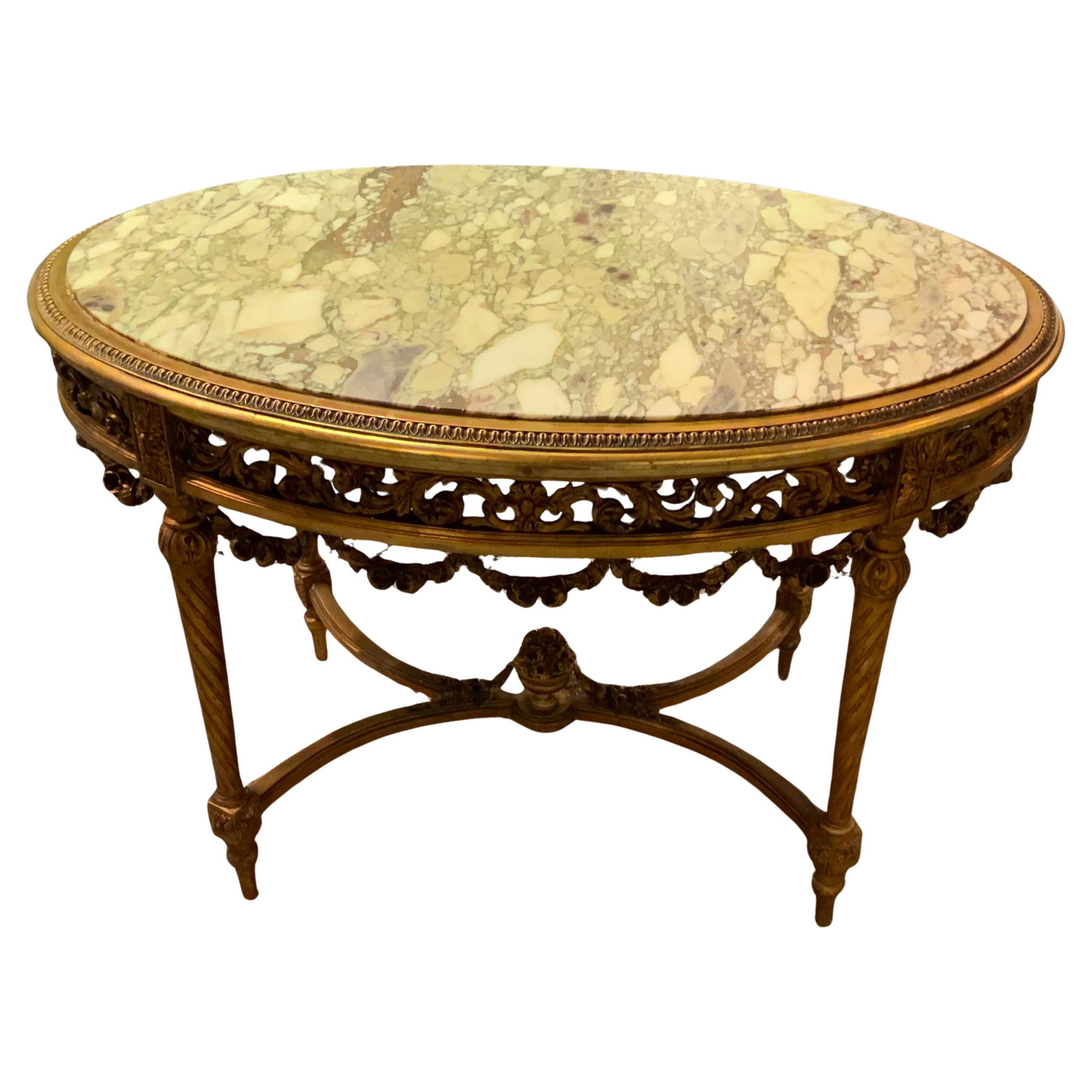 Louis XVI 19ème siècle Table centrale ovale en bois doré plateau en marbre