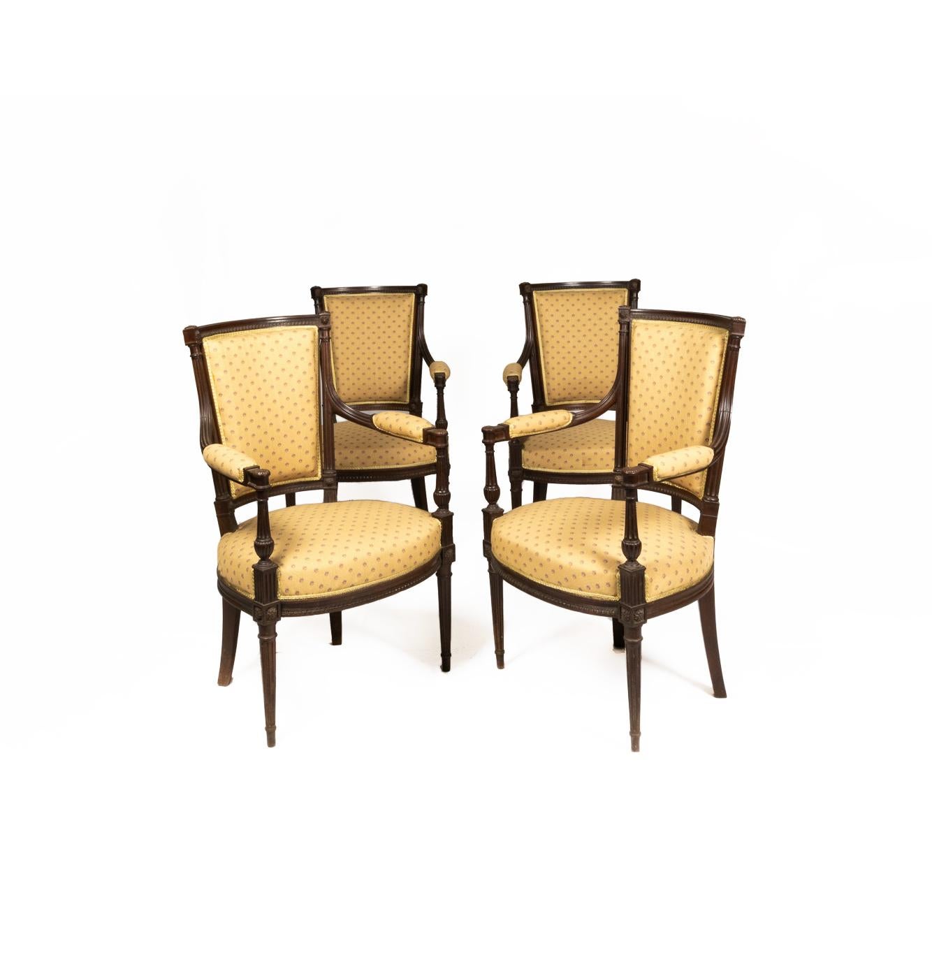 Louis XVI style salon suite: A five pieces with four armchairs and one canapé in cuban mahogany in “twisted rope” carving style.
Yellow upholstery with floral monogram. 
The structure was recently checked by a professional carpenter and has no