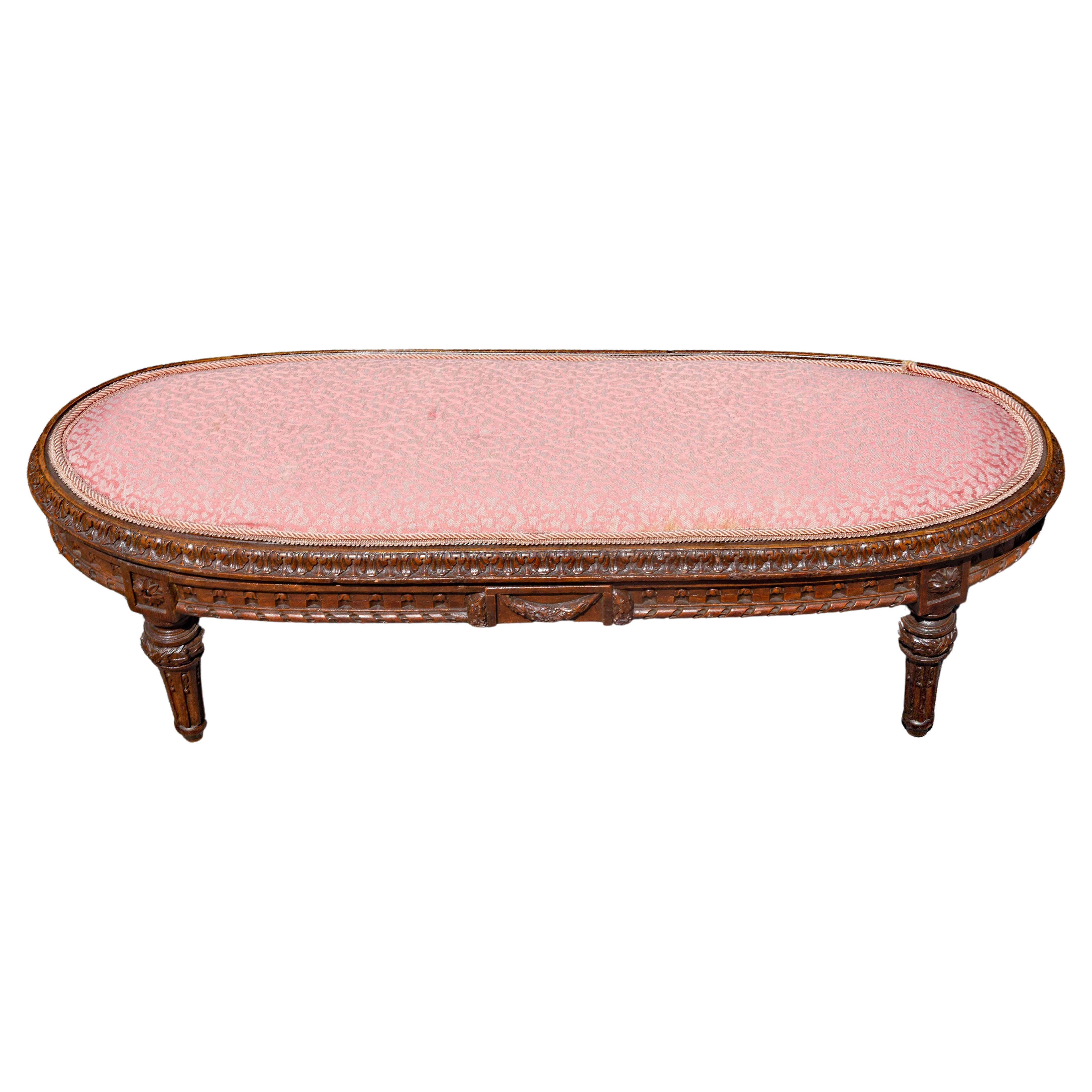 French 19th century Louis XVI style footstool. Carved walnut. Old upholstery shop label on bottom. 