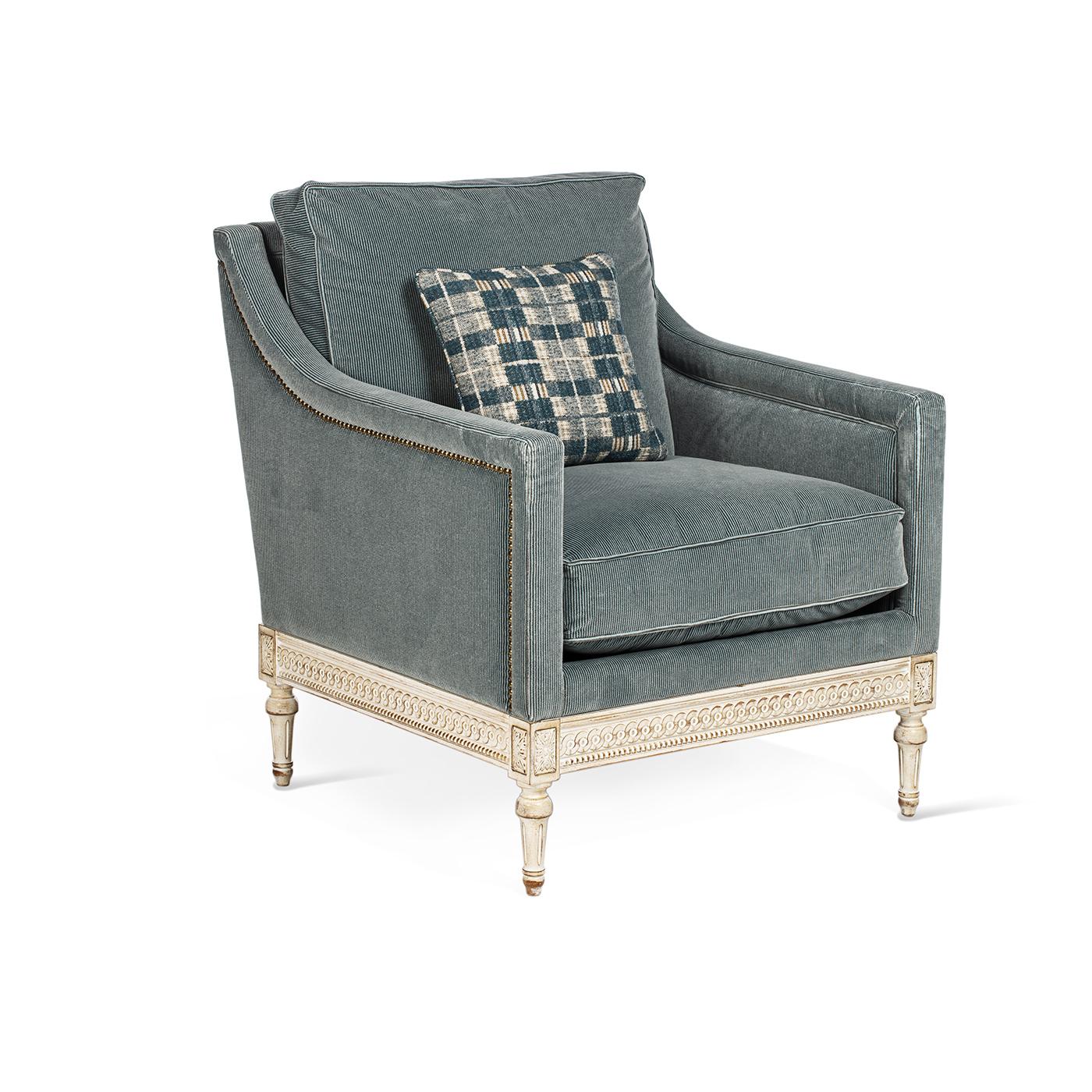 The Louis XVI armchair is characterized by straight armrests and a fully upholstered seat, with all the carvings completely hand-made. The structure is made in beechwood fully covered in light-blue fabric. The cushion is extra comfortable and in