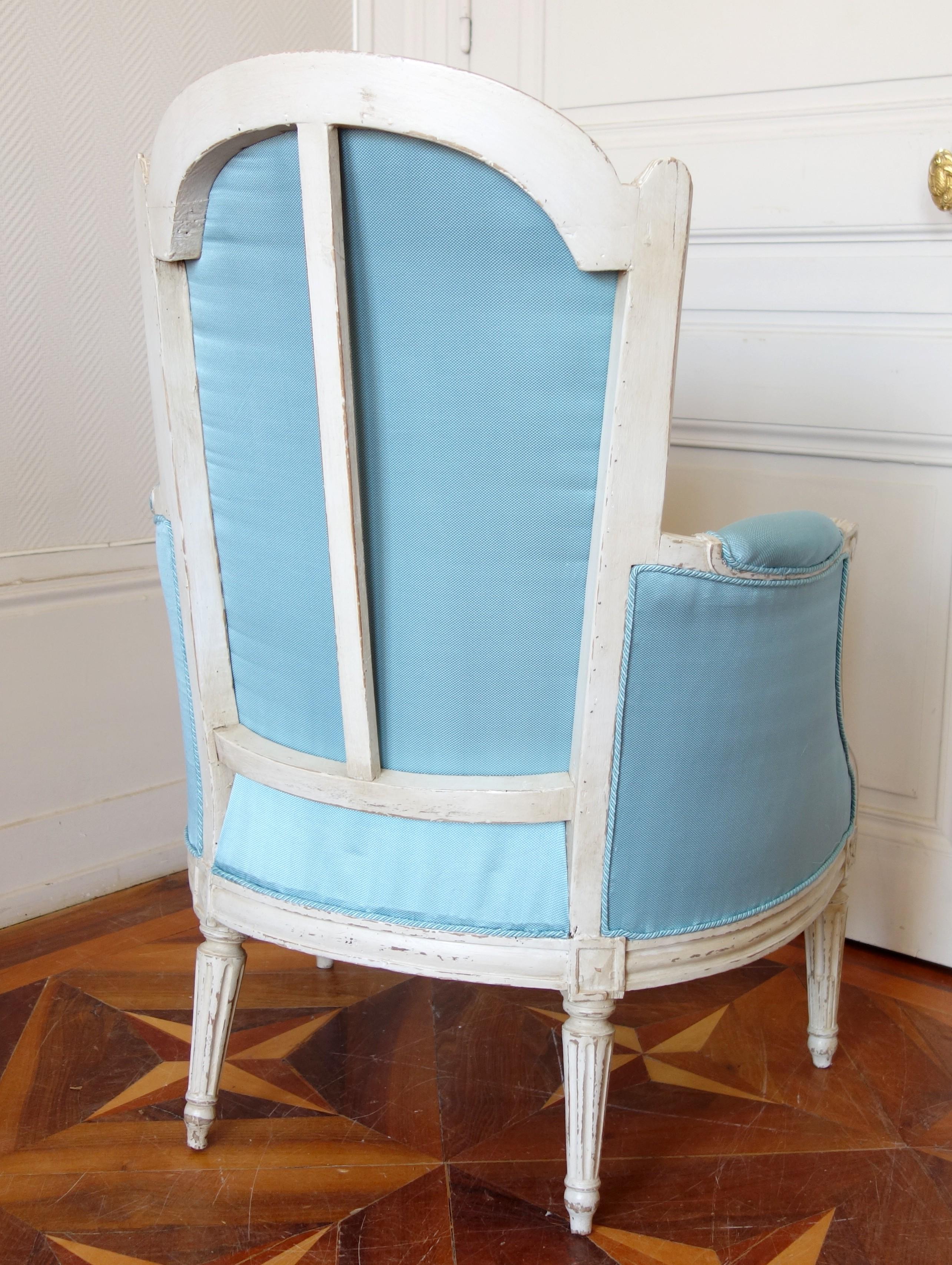 Lacquered Louis XVI armchair bergere, light bleu silk, 18th century