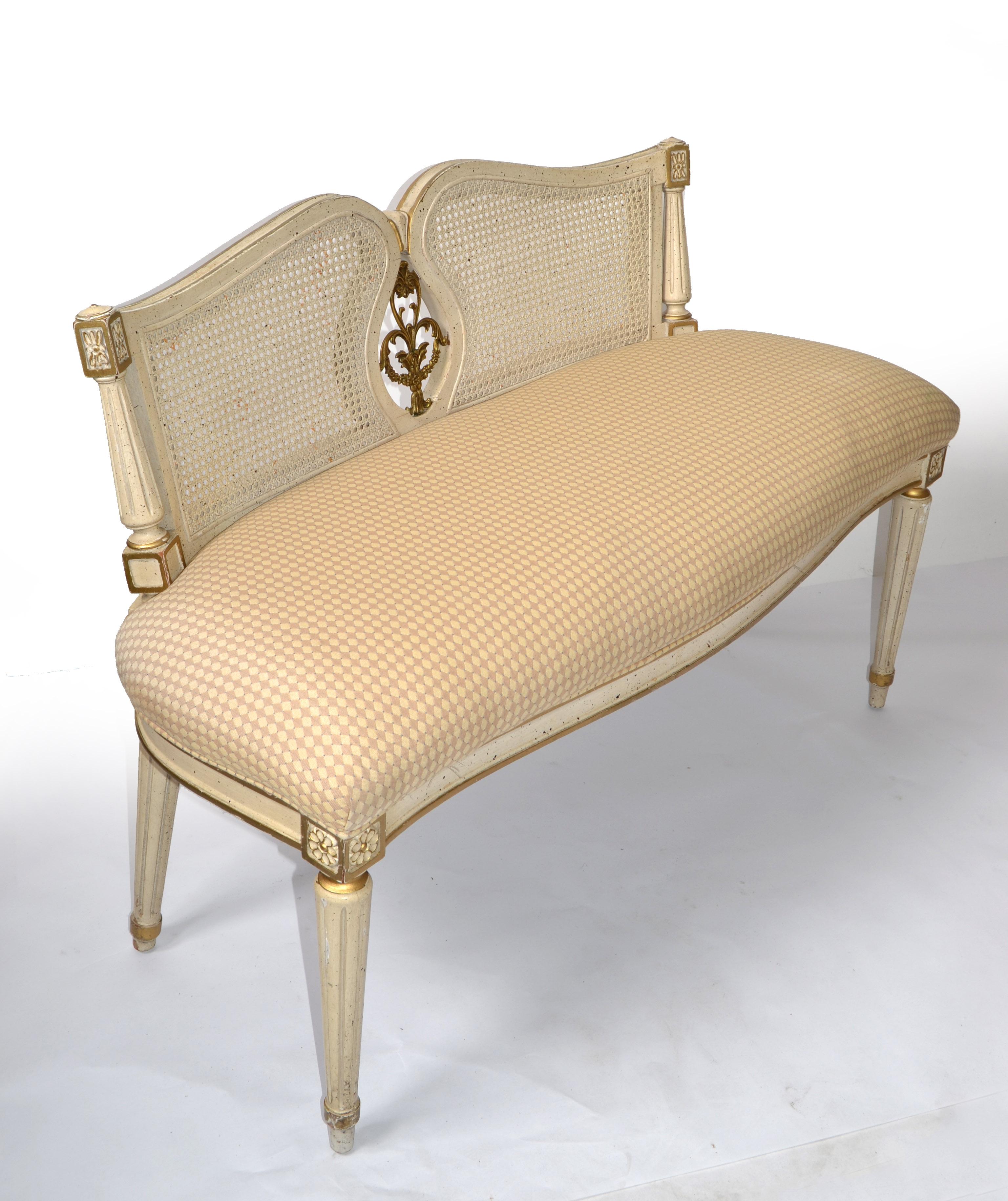 Exquisite Louis XVI Bench gilt hand carved hardwood, handwoven Cane Backrest and Taupe color Cotton Fabric Upholstery, made in USA. 
The tapered legs on this graceful French style bench are all hand carved. It is standard with a boxed pullover