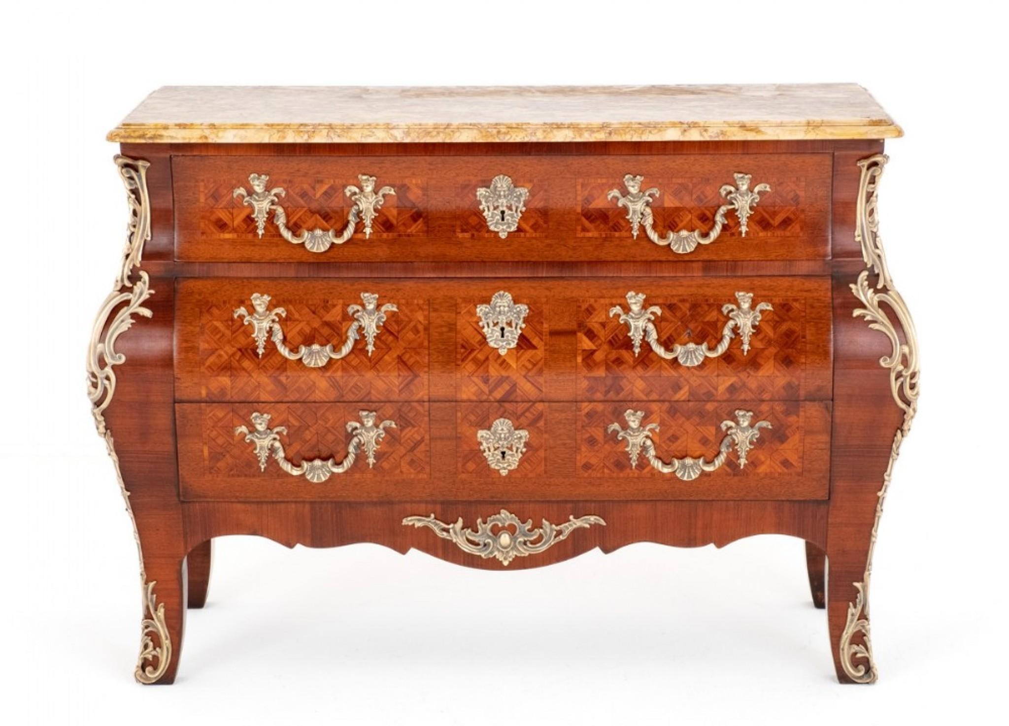 Impressive Louis XVI Style Commode.
Circa 1900
Combining the bombe shape with Louis XVI style elements creates a unique juxtaposition of curves and classical details. The result is a piece of furniture that exudes elegance and sophistication while