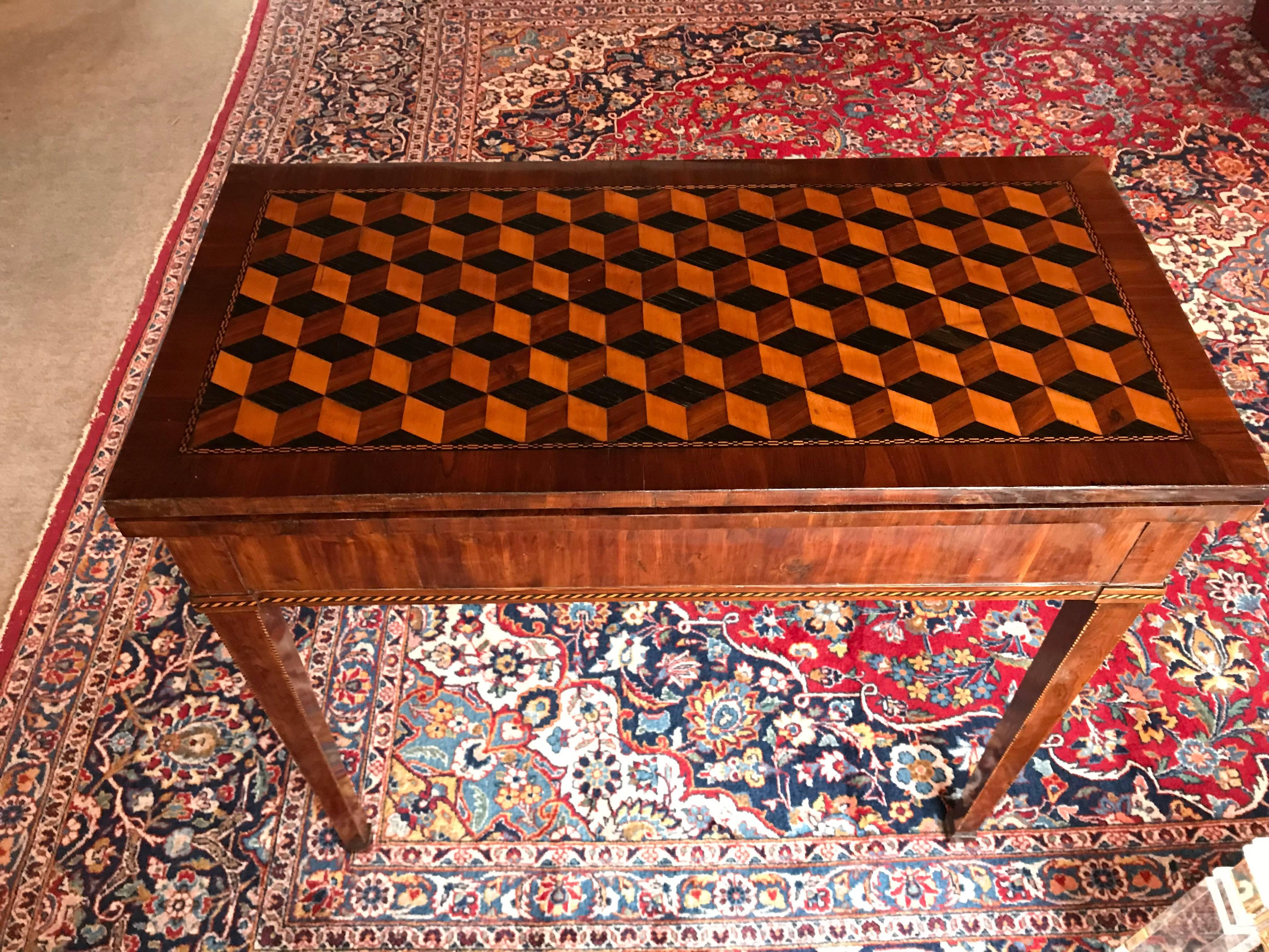 Unique 18th century Louis XVI card table, Strassburg region, king wood veneer and stunning satin wood, plum and king wood block marquetry on the top. The unfolded table top will be turned and rests on the base. The table is in good condition with a
