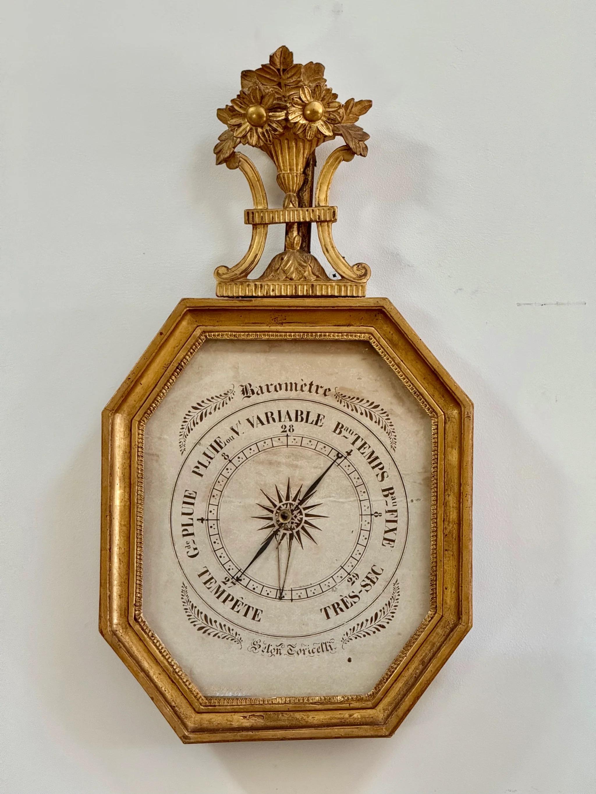 A lovely French Louis XVI carved and gilded barometer, c. 1785.

