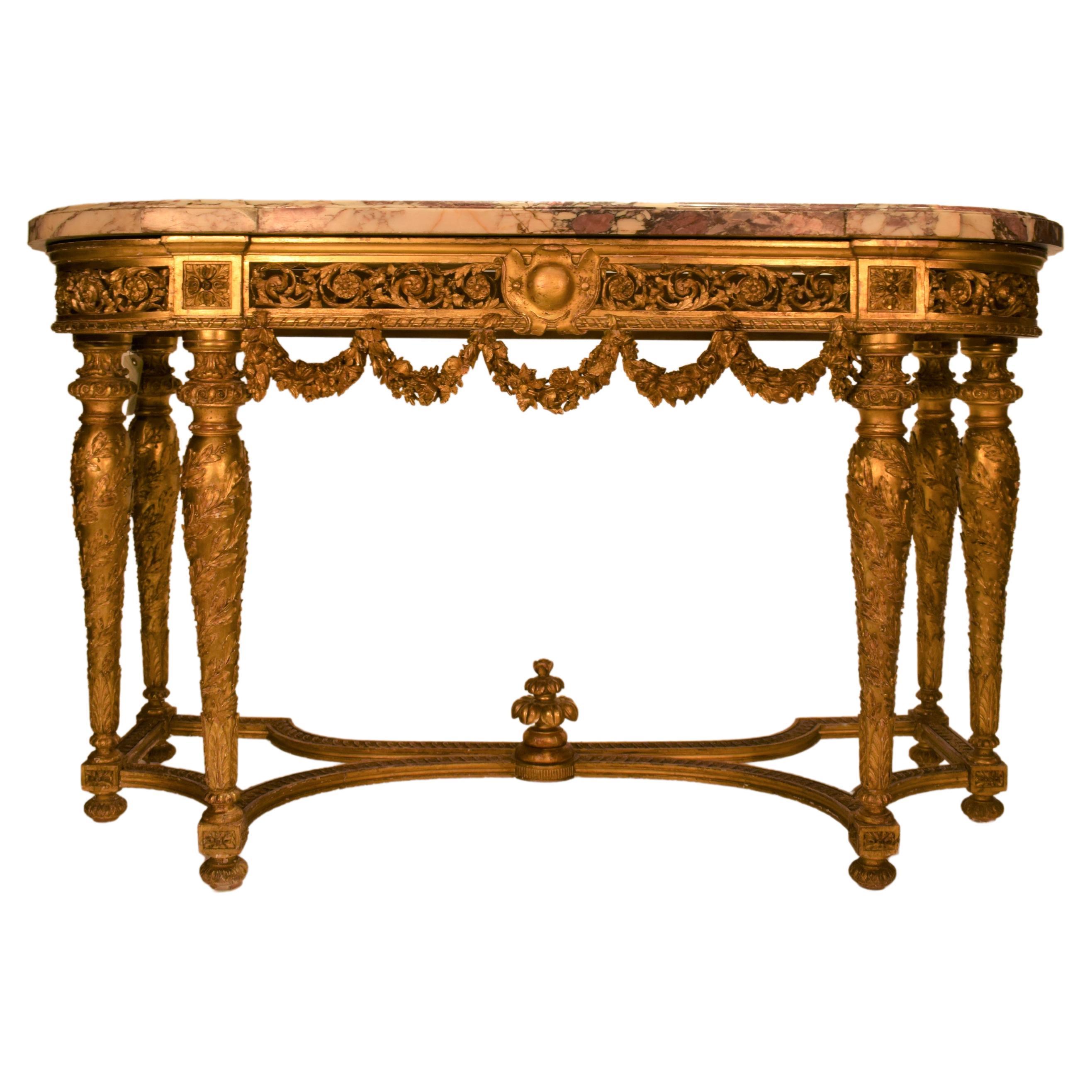 Table console Louis XVI en bois sculpté et doré « Fleur de Pecher » avec plateau en marbre en vente