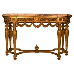 Table console Louis XVI en bois sculpté et doré « Fleur de Pecher » avec plateau en marbre