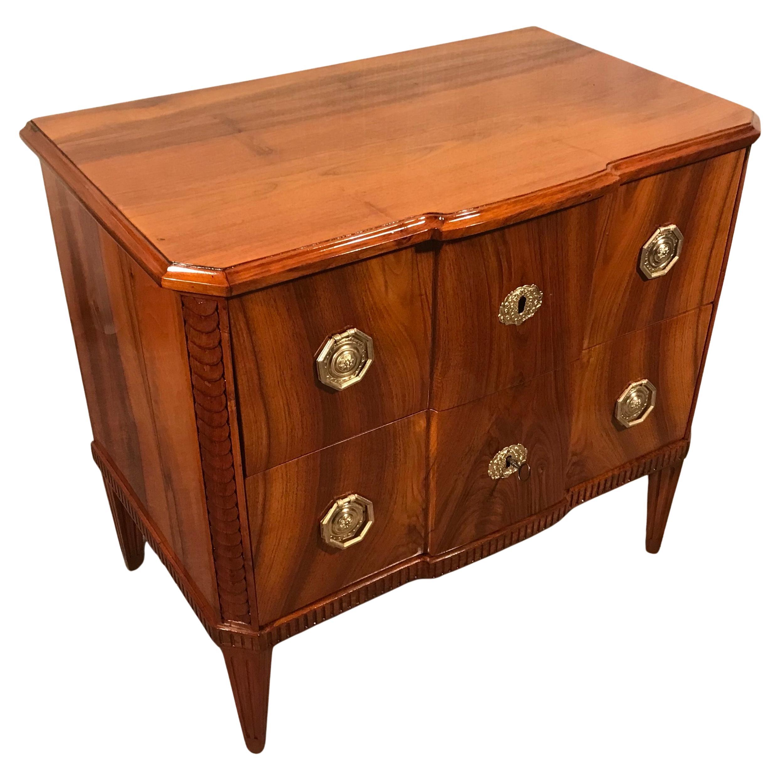 Uncover the historical charm of our Antique Louis XVI Chest of Drawers, a masterpiece dating back to 1780 and hailing from Southern Germany. Crafted with precision from solid walnut, this one-of-a-kind dresser stands on gracefully tapering legs,