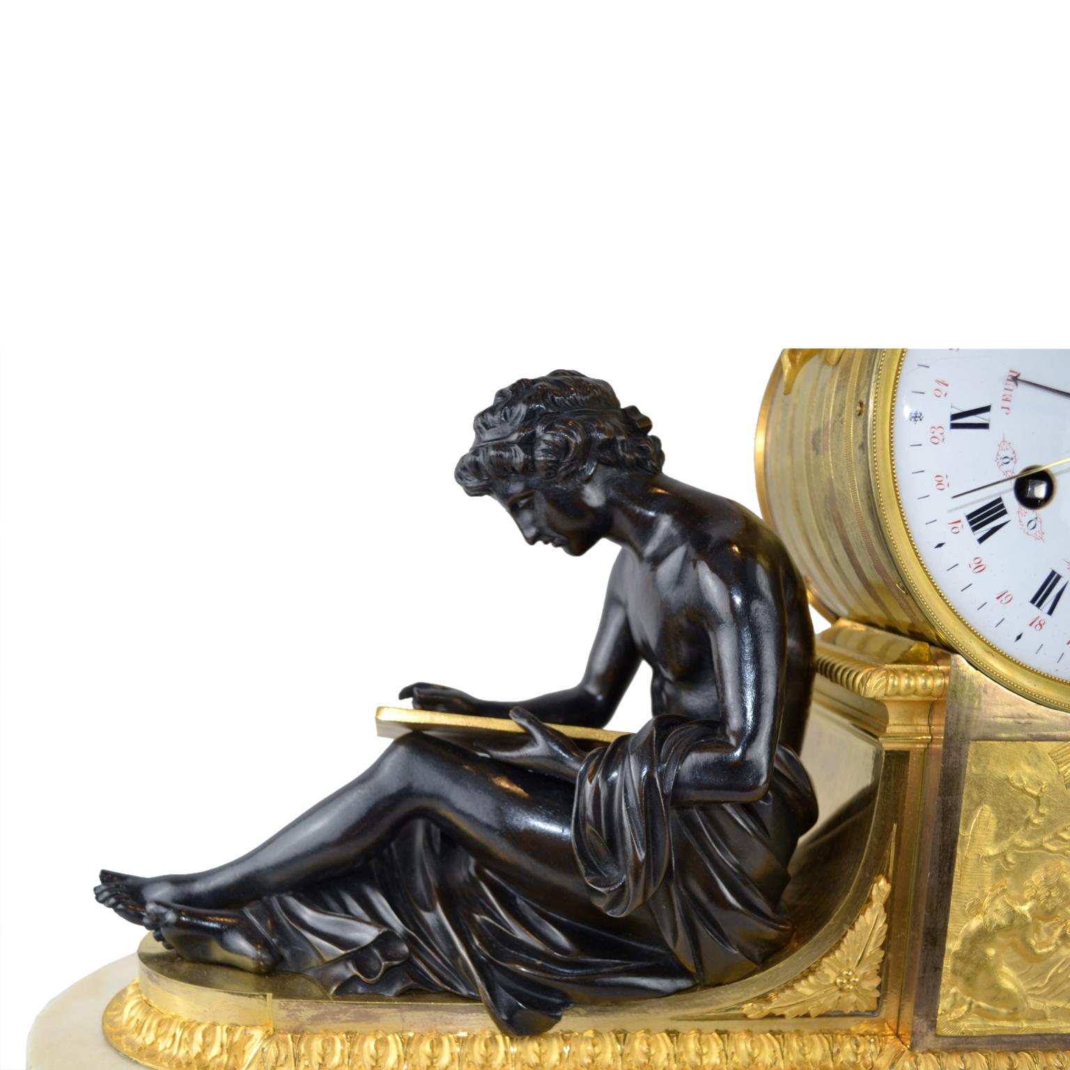 A Louis XVI mantle clock depicting “L’Etude et La Philosophie” (Learning and Philosophy). The clock is comprised of a circular white-enamelled dial with Roman hours and Arabic quarter marks and a further inner Arabic chapter ring for the day of
