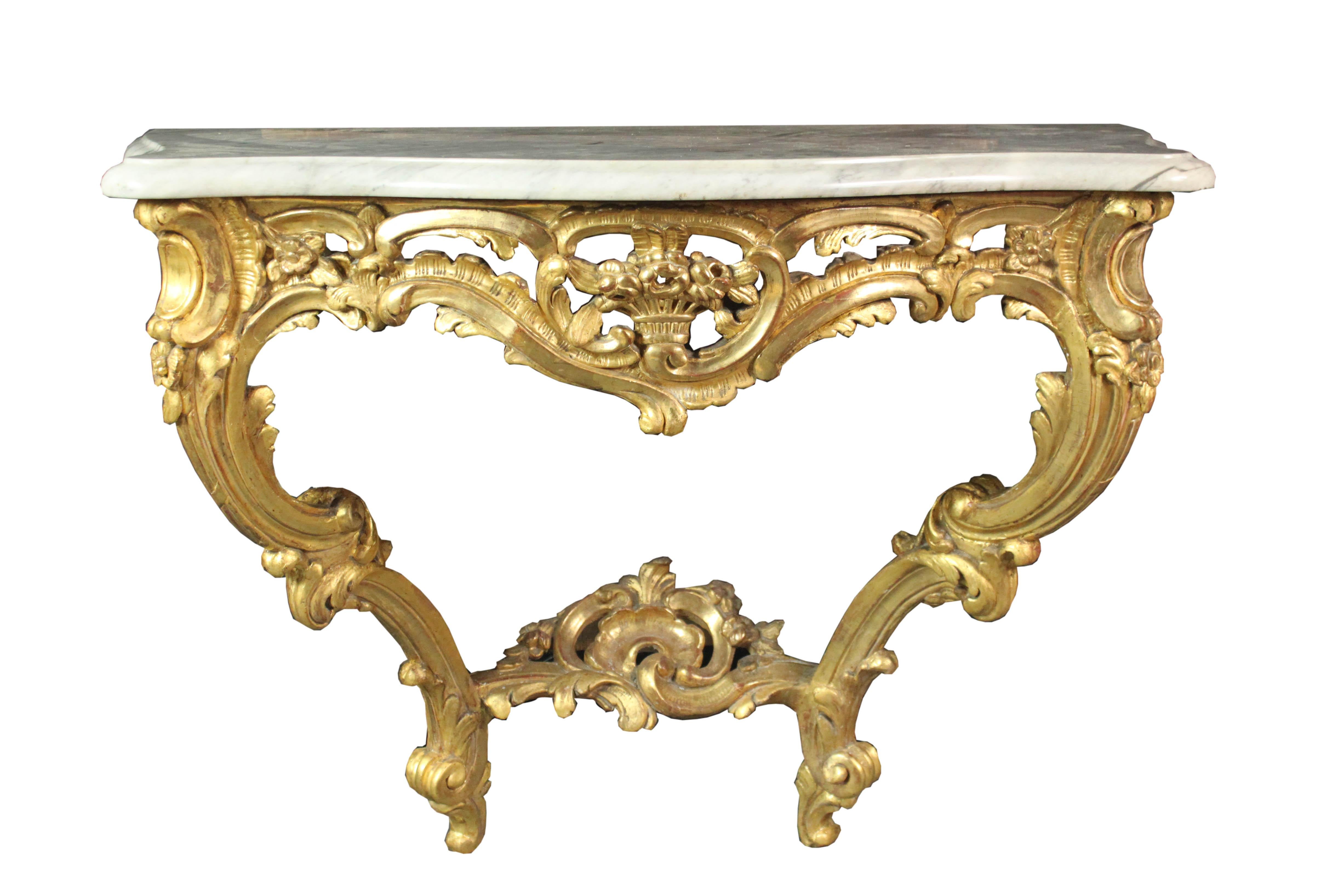 A fine Louis XVI carved giltwood console table and Louis XVI carved giltwood pier mirror. White Carrara marble top. Provenance: bought in a chateau in the Garonne Region, France. Console measures: 43” x 21” x 32” high, mirror 31” x 80” high.