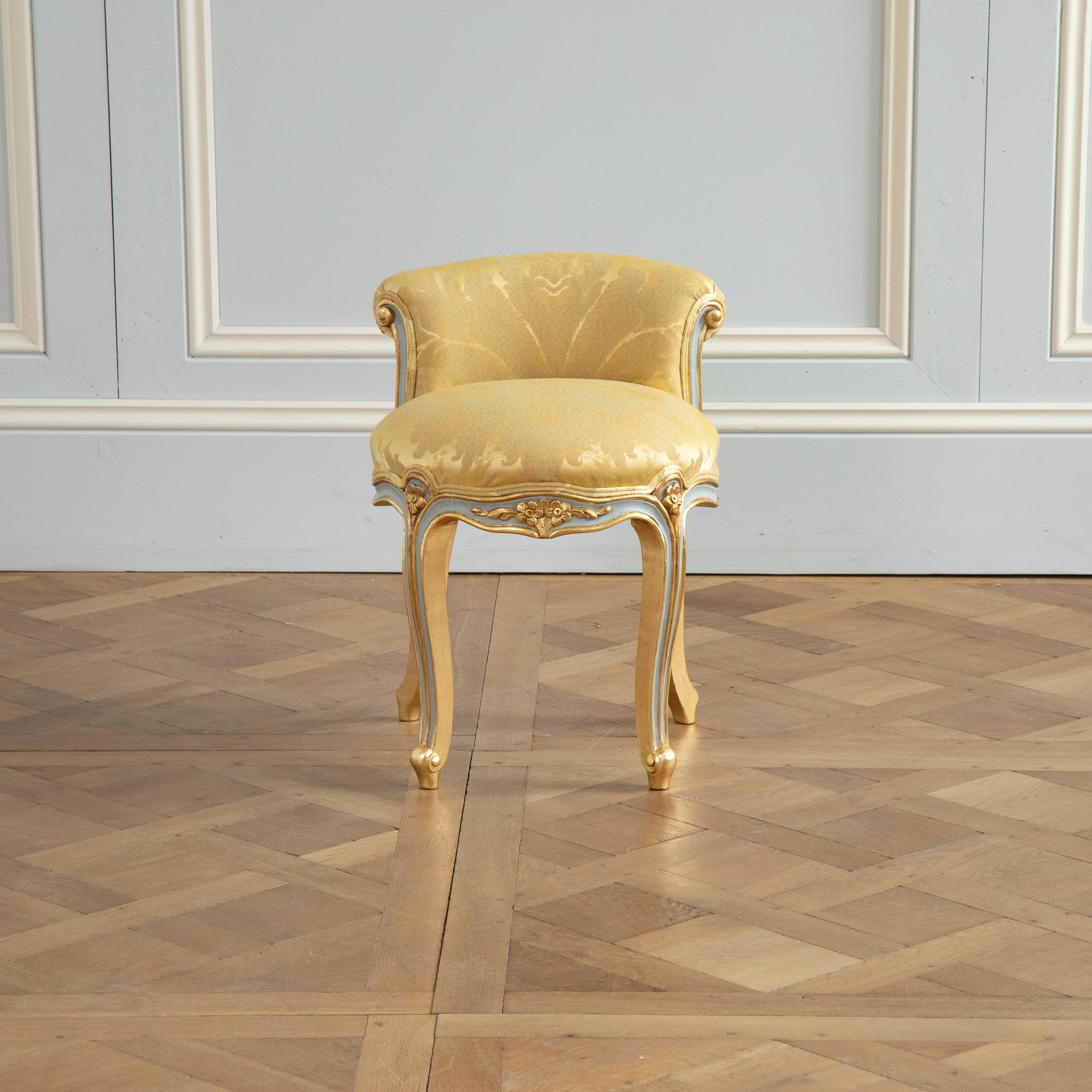 Louis XV crosse renverse style stool painted in a french grey with gold highlights.