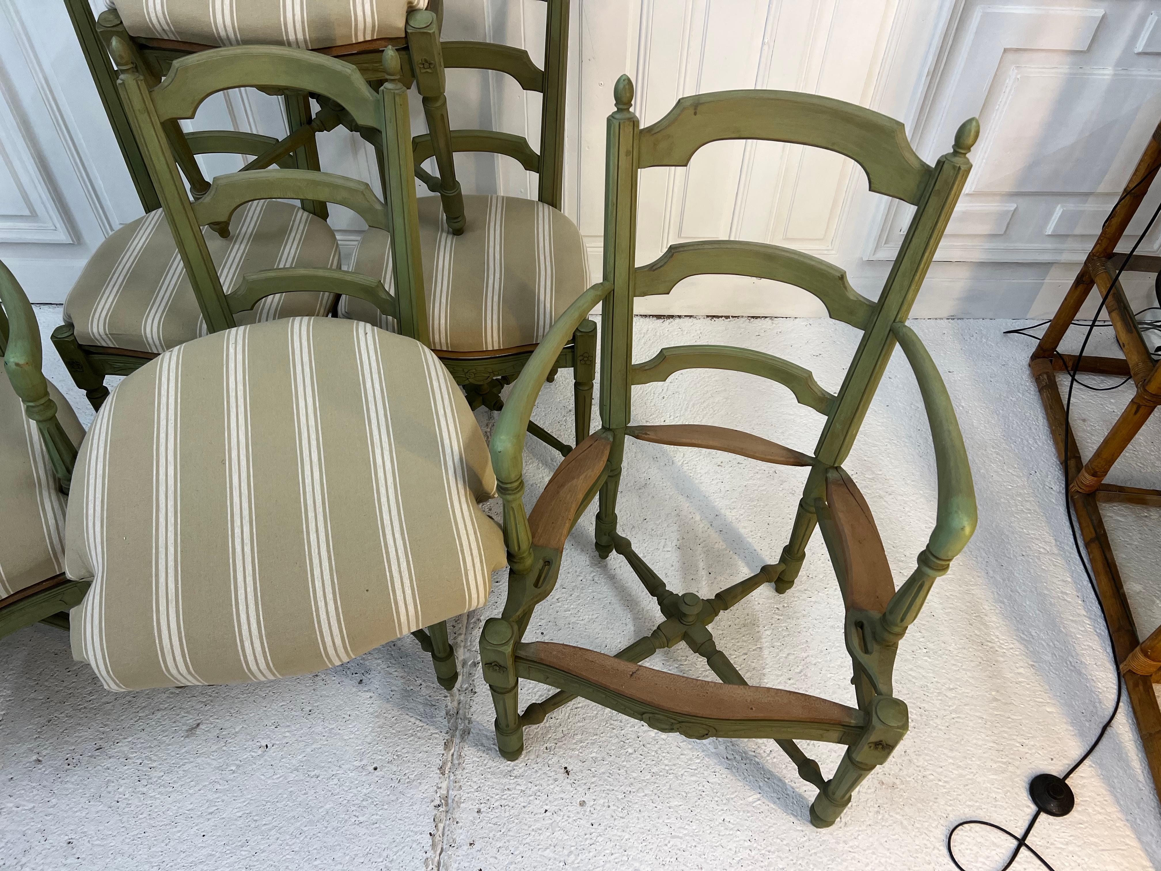 4 chairs and 2 Louis XVI style armchairs with green patina
the seats have been reupholstered in a mattress fabric
the pediments are finely sculpted with Louis XVI garlands, the base is in X shaped tops
the seats will be easily to customize to