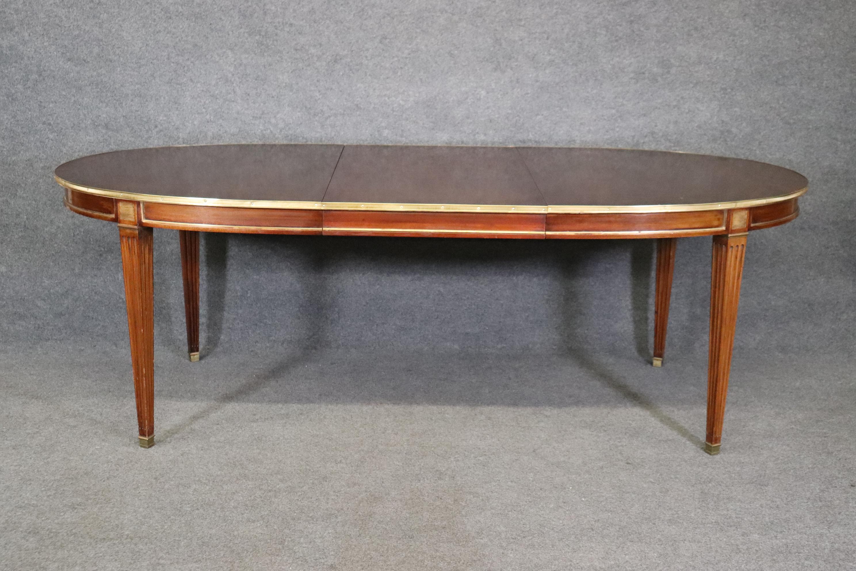 Dimensions- H: 30 1/4in W Closed: 66 1/4in D: 42 1/4in (W Leaf: 23 3/4in)

This Maison Jansen French Louis XVI Directoire style dining room table is truly a show stopper and gives off a sophisticated and minimalistic luxury vibe wherever it's