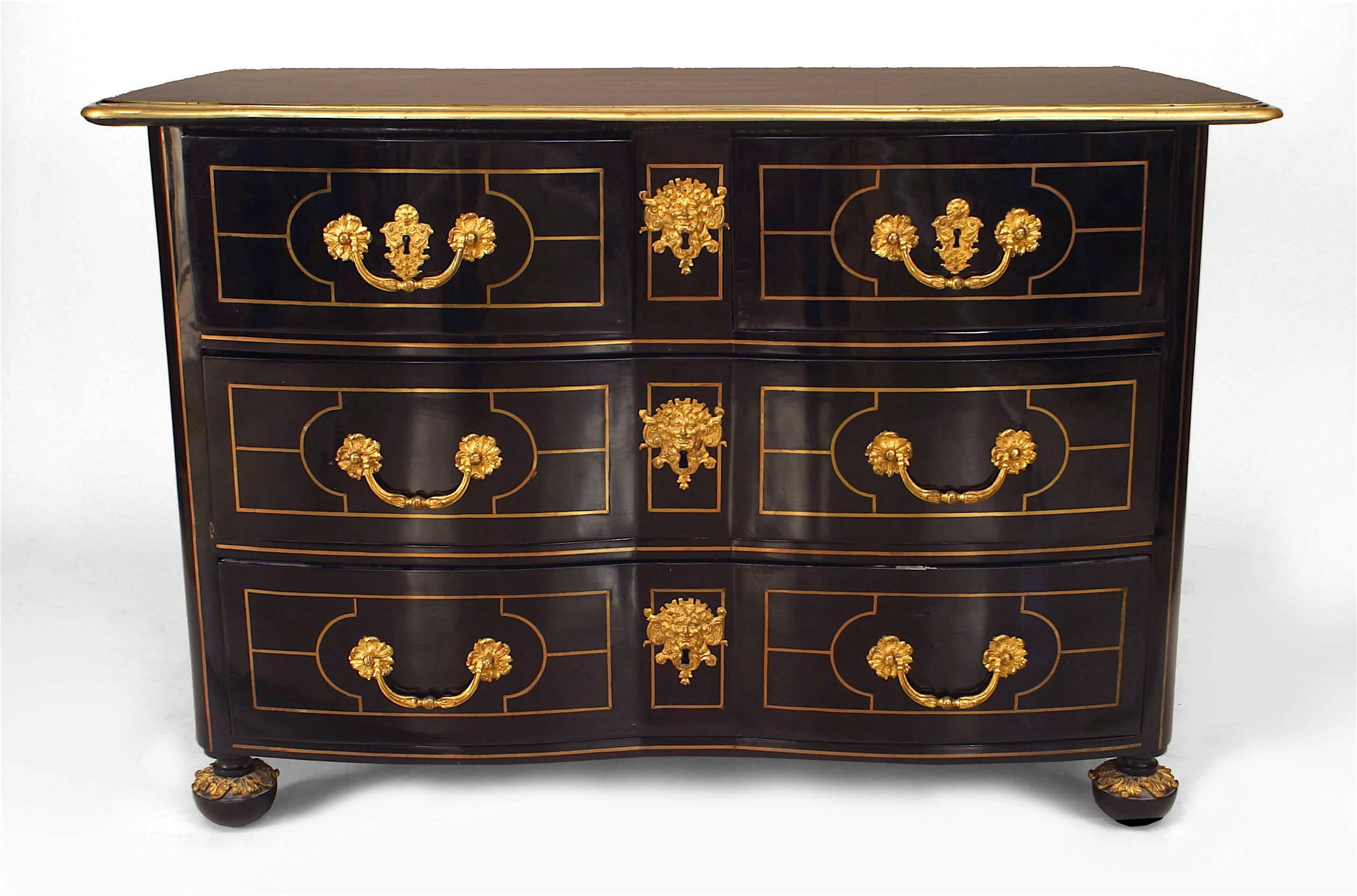 French Louis XVI commode featuring six drawers, an ebonized finish, a geometric brass pin-lined inlay, bronze trim, and opulent bronze locks and drawer handles.