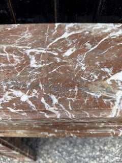 Louis XVI fireplace in red Rance marble, late 18th century