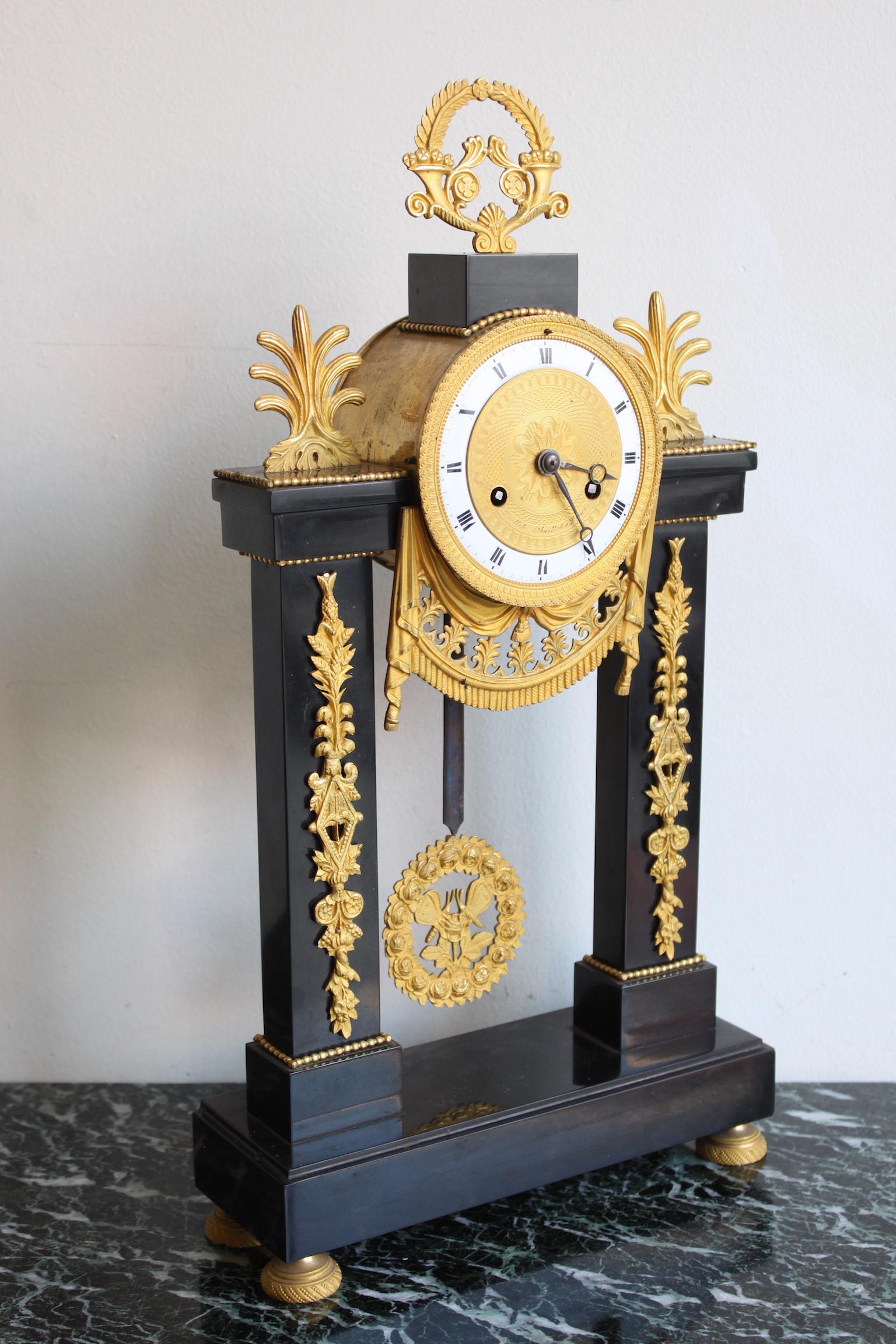 Louis XVI French black marble and gilt bronze gantry clock. 
Dial signed 