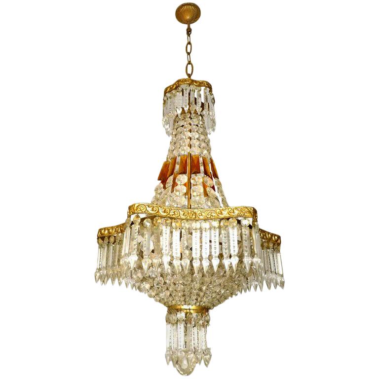 Gorgeous six-light French Empire amber crystal basket chandelier with a hexagonal gilt bronze frame.
   
Measures:
Diameter 19 in/ 48 cm
Height 43.3 in(10 in chain) / 110 cm (25 cm chain)
Weight: 20 lb/ 9 Kg
Six light bulbs E14, good working