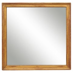 Louis XVI French Giltwood Mirror with Fluted Detail 
Original Plate, ca. 1800