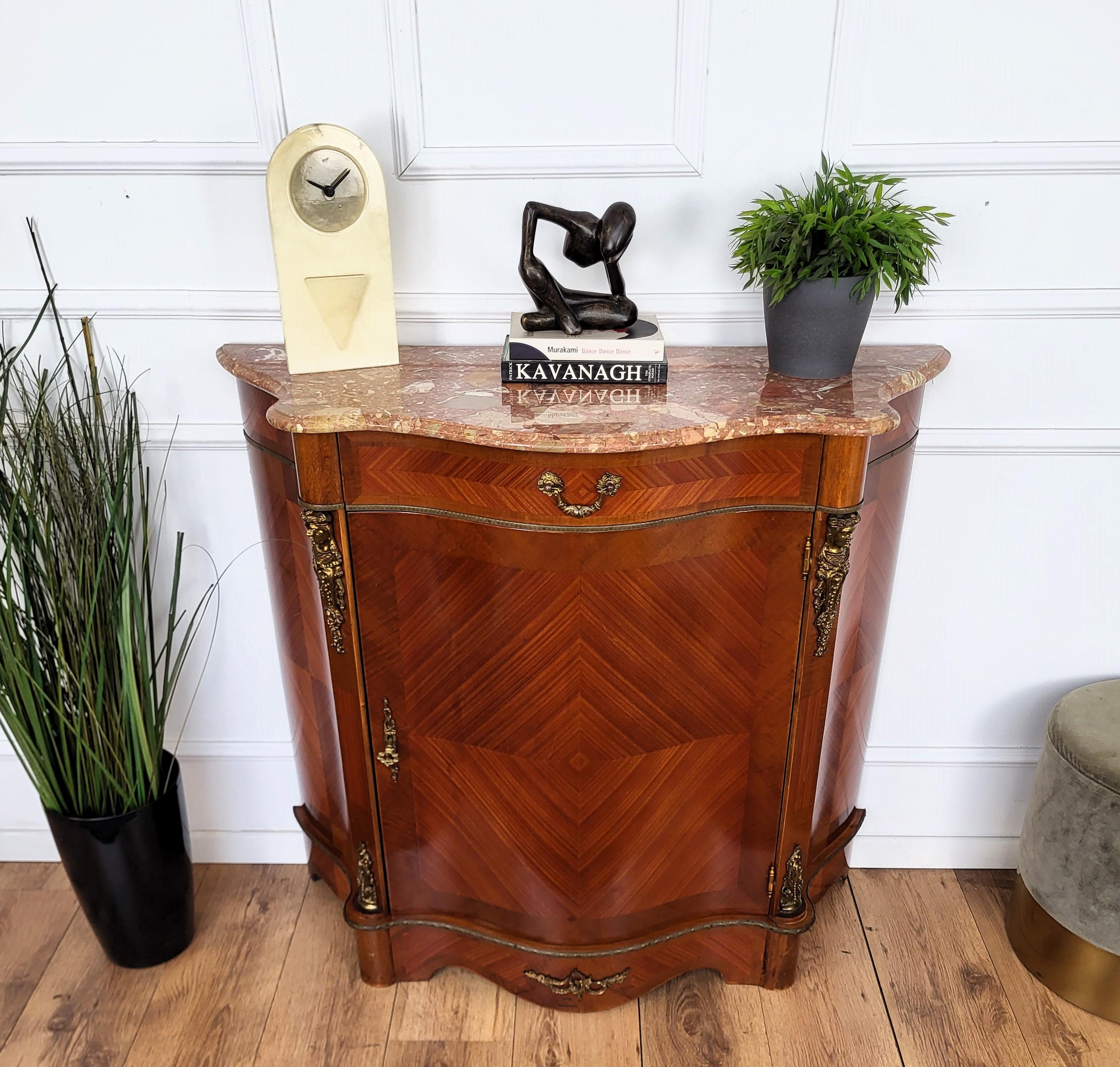 A beautiful Louis XVI style walnut veneer marquetry cabinet buffet with great ormolu decors details and frames with beveled and greatly shaped marble top. This piece has a frontal door and a drawer, both shaped to the Louis XVI style. A very