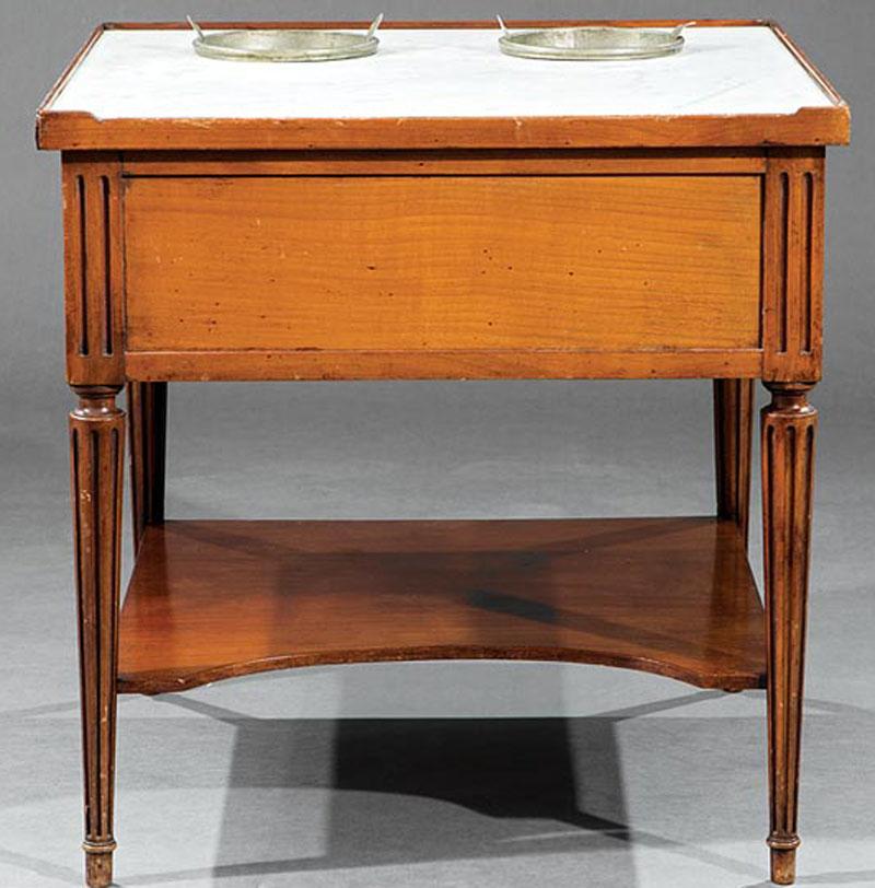 Louis XVI Fruitwood Rafraîchissoir, late 18th century, inset marble top fitted with wine coolers, stop-fluted stiles and tapered legs, stretcher shelf, h. 24 in., w. 23 3/4 in., d. 23 3/4 in.