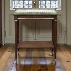 Louis XVI Gallery Table in solid mahogany with a refined marble top, pierced bra