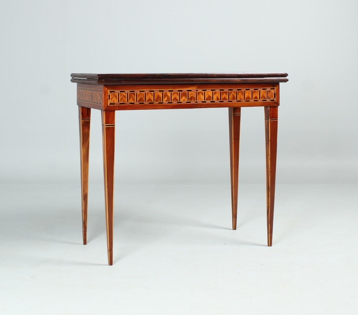 South-West Germany
Plum wood u.a.
around 1800

Dimensions: approx. H x D x D: 76 x 86 x 43 cm

Description:
Antique console with rich marquetry and hinged playfield. Particularly rare is the all-over veneer in plum wood. Maple and ebony set