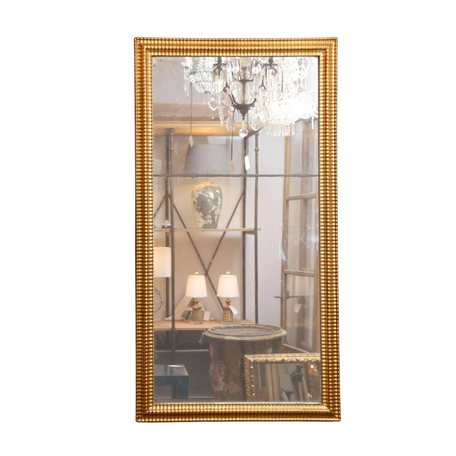 Doré Miroir Louis XVI en bois doré en vente