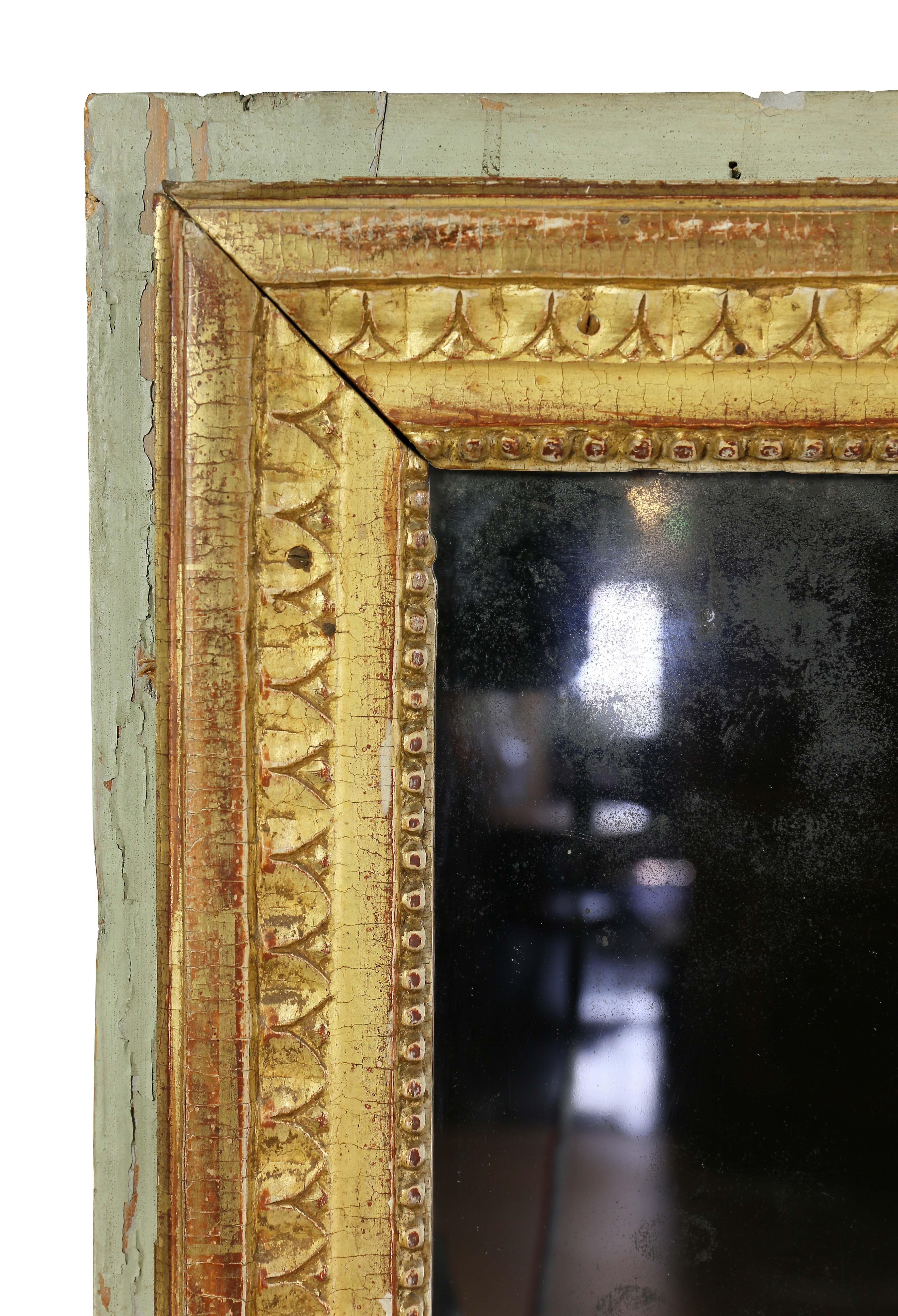 Rectangular with light green outer border and gilt inner band with leaf tip and beaded decoration. Two part old mirror plate with oxidation. Provenance; William Hodgins , Boston.