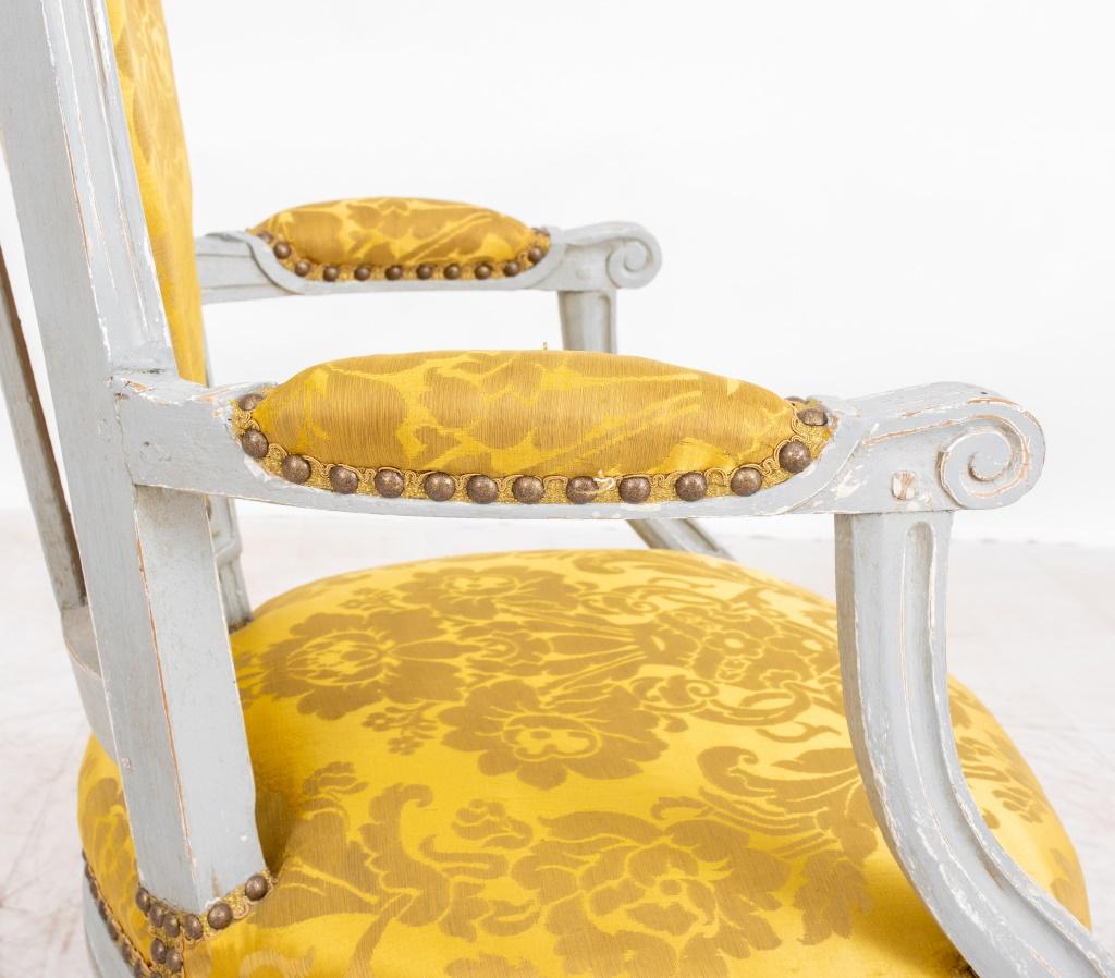 Louis XVI gray-painted fauteuils, a pair (2), or arm chairs, ca. 1780 and after models by  Henri Jacob (French, 1753-1824) and  Georges Jacob (1739–1814), the chair ca. 1780s, each signed on underside of seatrail with indistinct stamp. 34