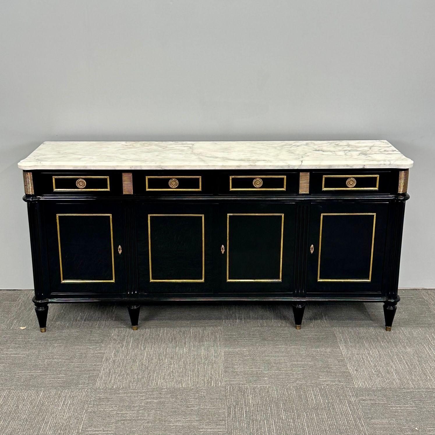 Louis XVI Hollywood Regency Black Lacquer Sideboard / Credenza, Bronze Mounted
 
A simply stunning palatial sideboard or credenza in the fashion of Maison Jansen. This newly ebonized bronze mounted sideboard having a bronze box framed case with