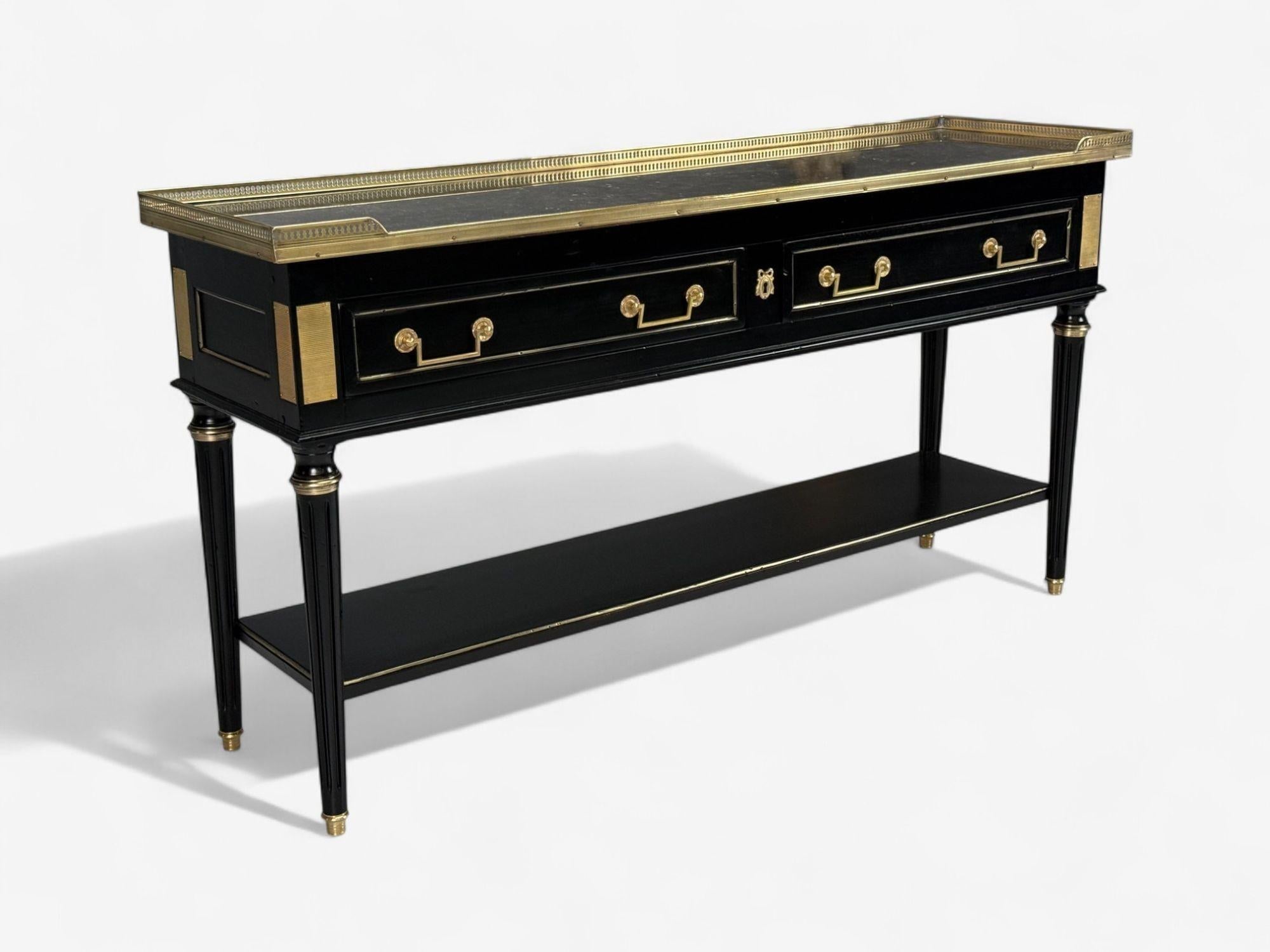 Louis XVI, Hollywood Regency, Mahogany, Bronze, Marble, Ebonized Console, France, 1930s

A Hollywood Regency style ebonized console designed and produced in France c. 1930s. This example, in the manner of Maison Jansen, has been fully refinished in