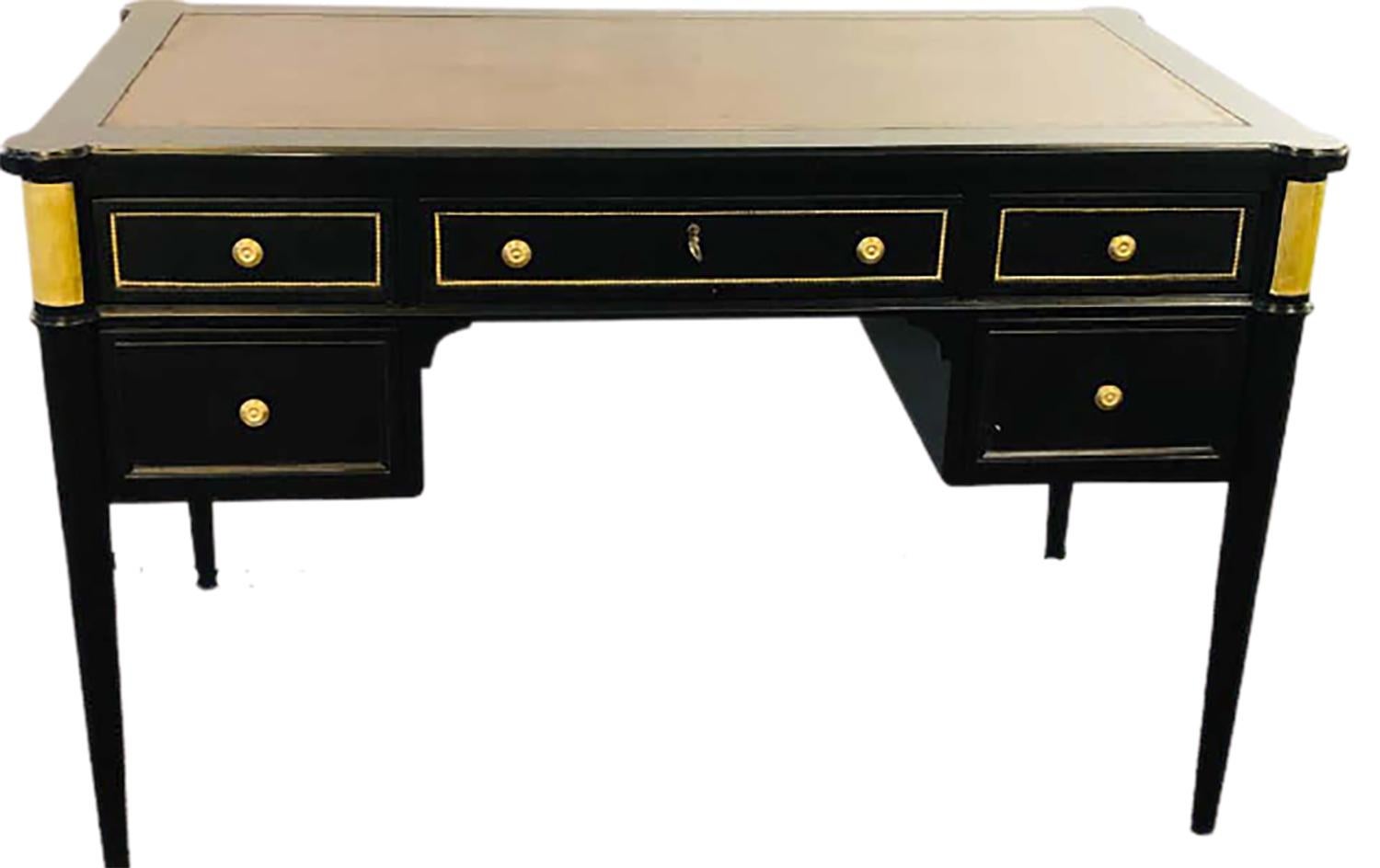 Hollywood Regency ebony desk manner of Maison Jansen bronze mounted in the Louis XVI style. This simply sleek and stylish stunning knee hole desk depicts the Hollywood Regency Era of Glamour at its peck. Done in the style of Iconic designer Maison