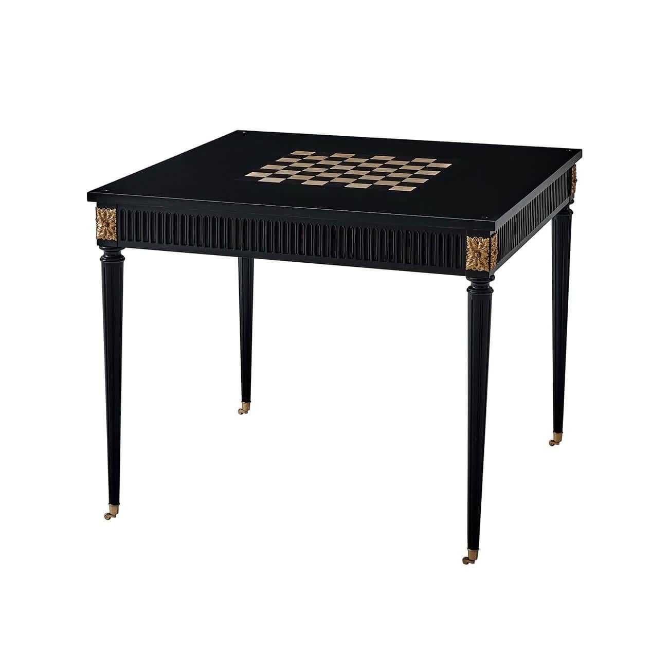 A Louis XVI style ebonized square game table with a tooled leather top reversible to expose the chessboard, with a carved fluted frieze and brass acanthus mounts and raised on turned and flited legs with brass casters.

Dimensions: 36