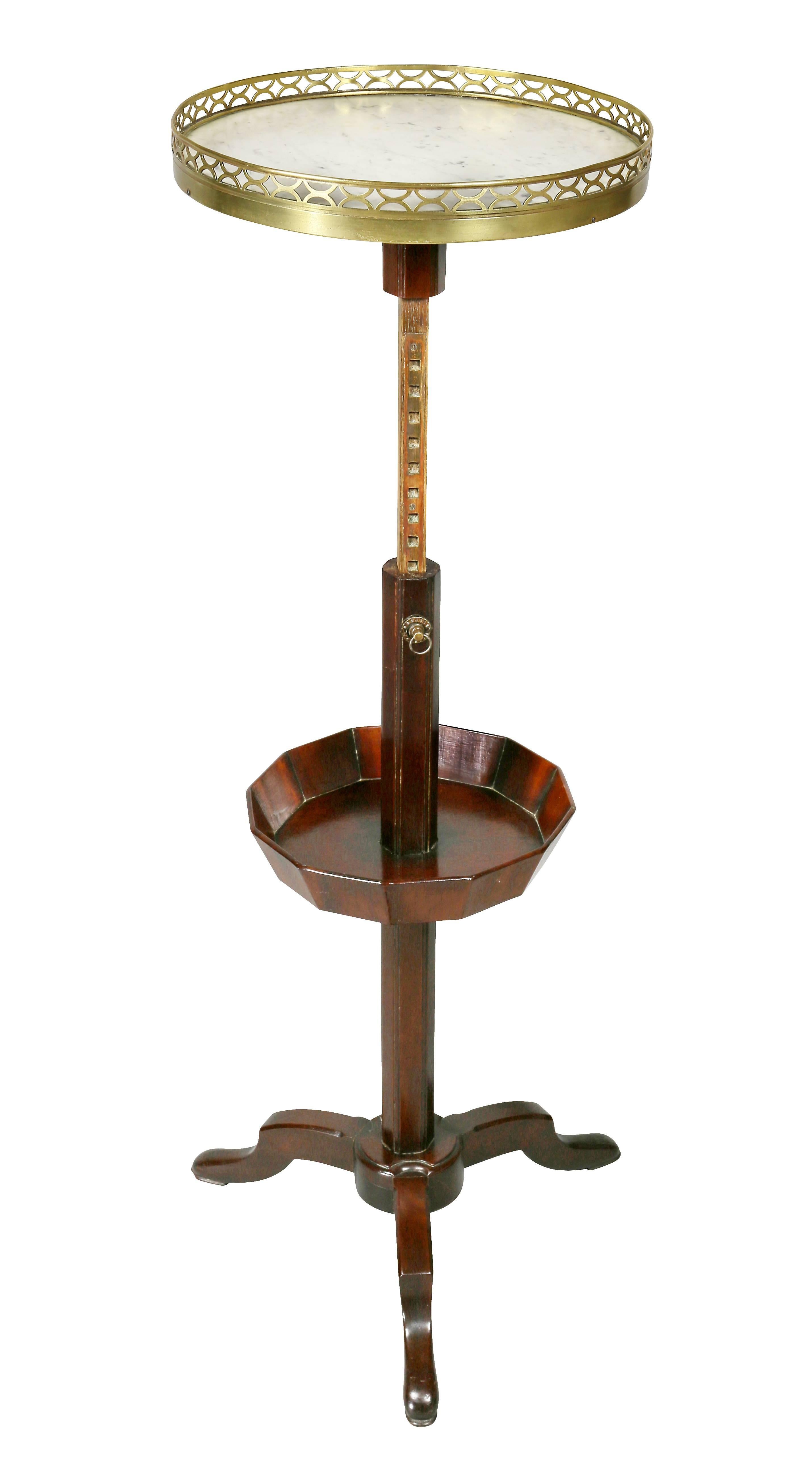 Signed Bailly on underside of base circular white marble top and brass gallery with adjustable ratcheted support with lower basket and raised on tripod base.