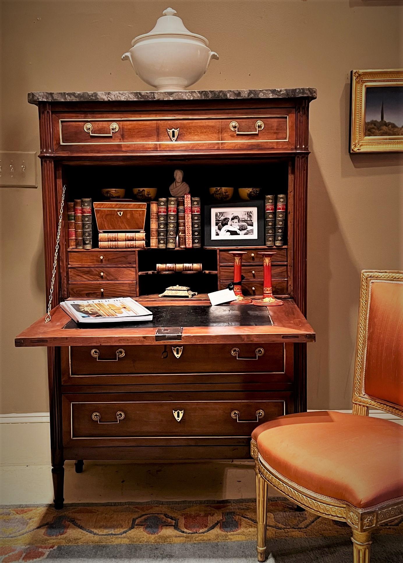 This neo-classic fall-front secretary not only has the beauty of Louis XVI style furniture but is very practical for modern living. It is perfect for small spaces, yet still provides a lot of storage and a large desk surface quite suitable for a