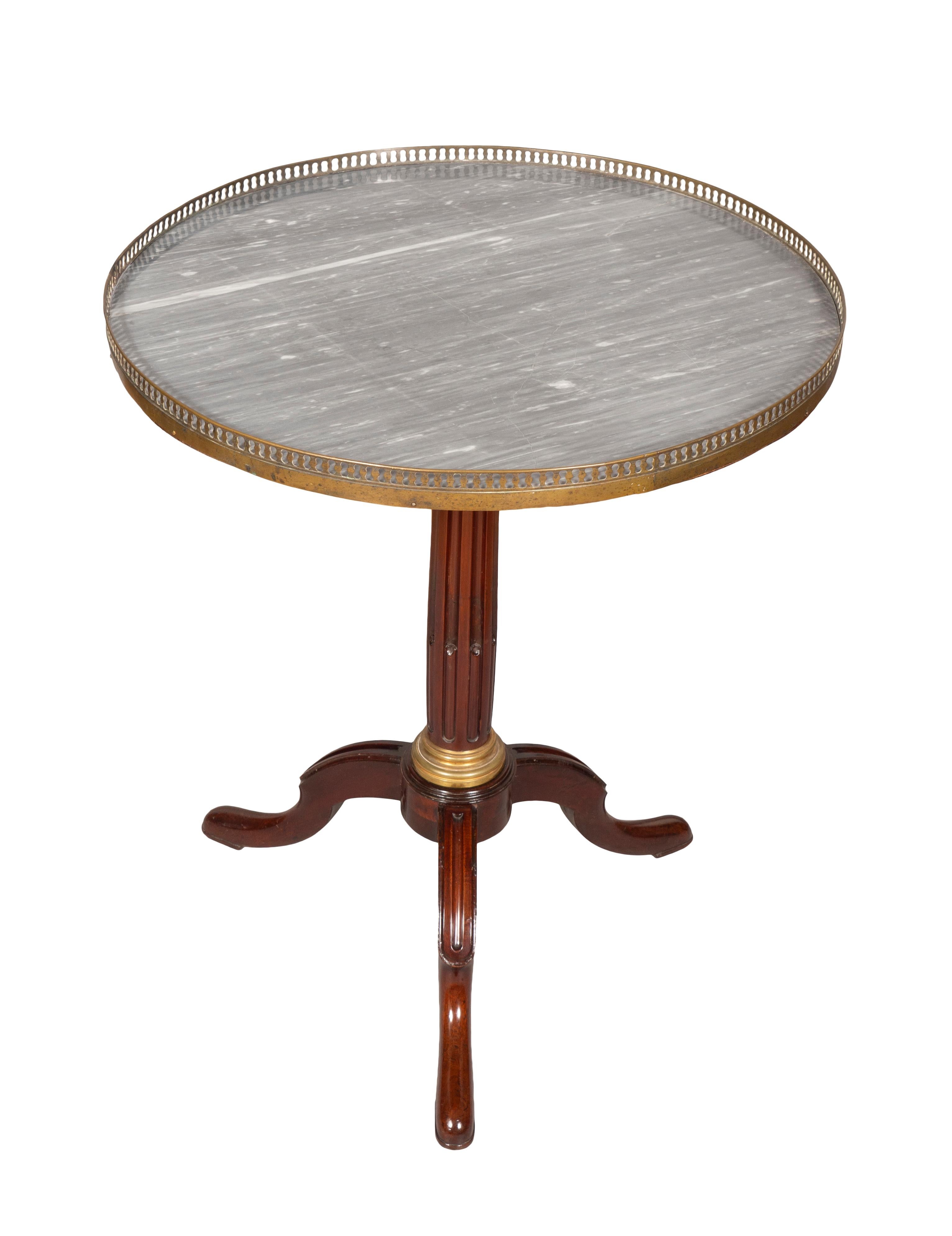 Circular hinged bleu turquin marble top with brass gallery with turned stop fluted support joining three legs.