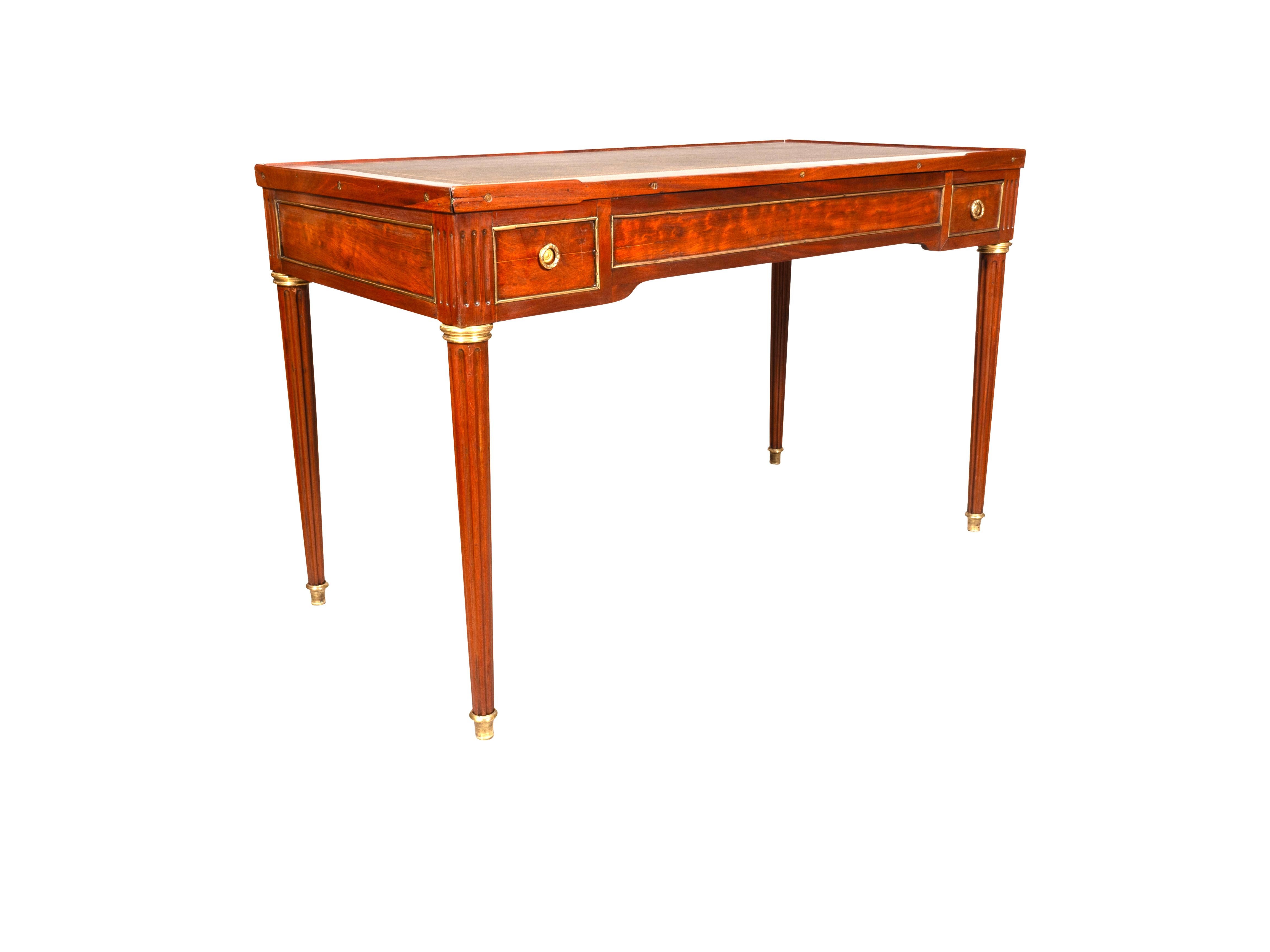Rectangular removable green leather top with reversible felt playing surface , exposing a backgammon playing surface. Opposing chip drawers and raised on square tapered fluted legs ending on sabot feet.