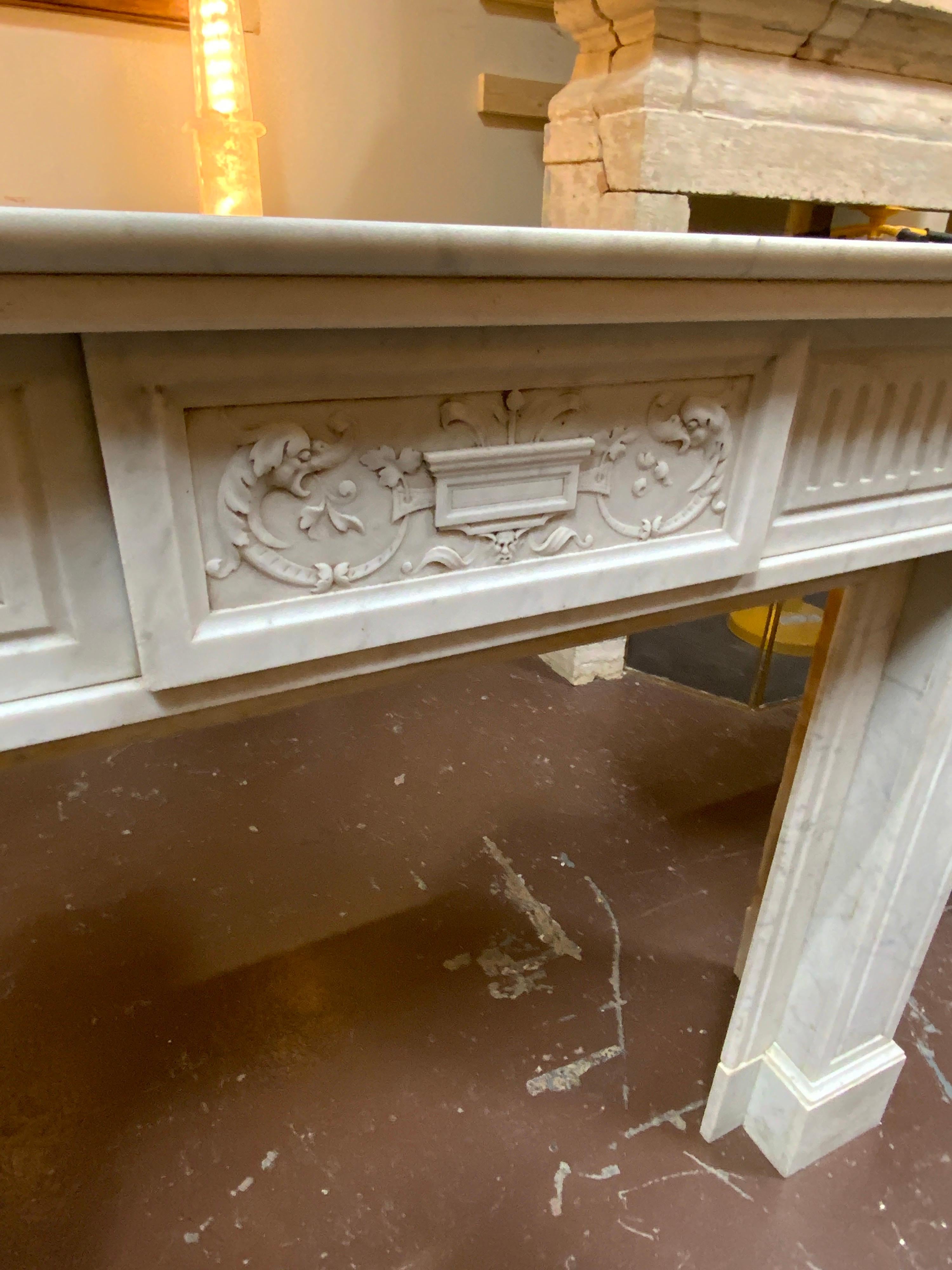 19th Century Louis XVI Marble Mantel with Fluting and Gargoyle Motif For Sale