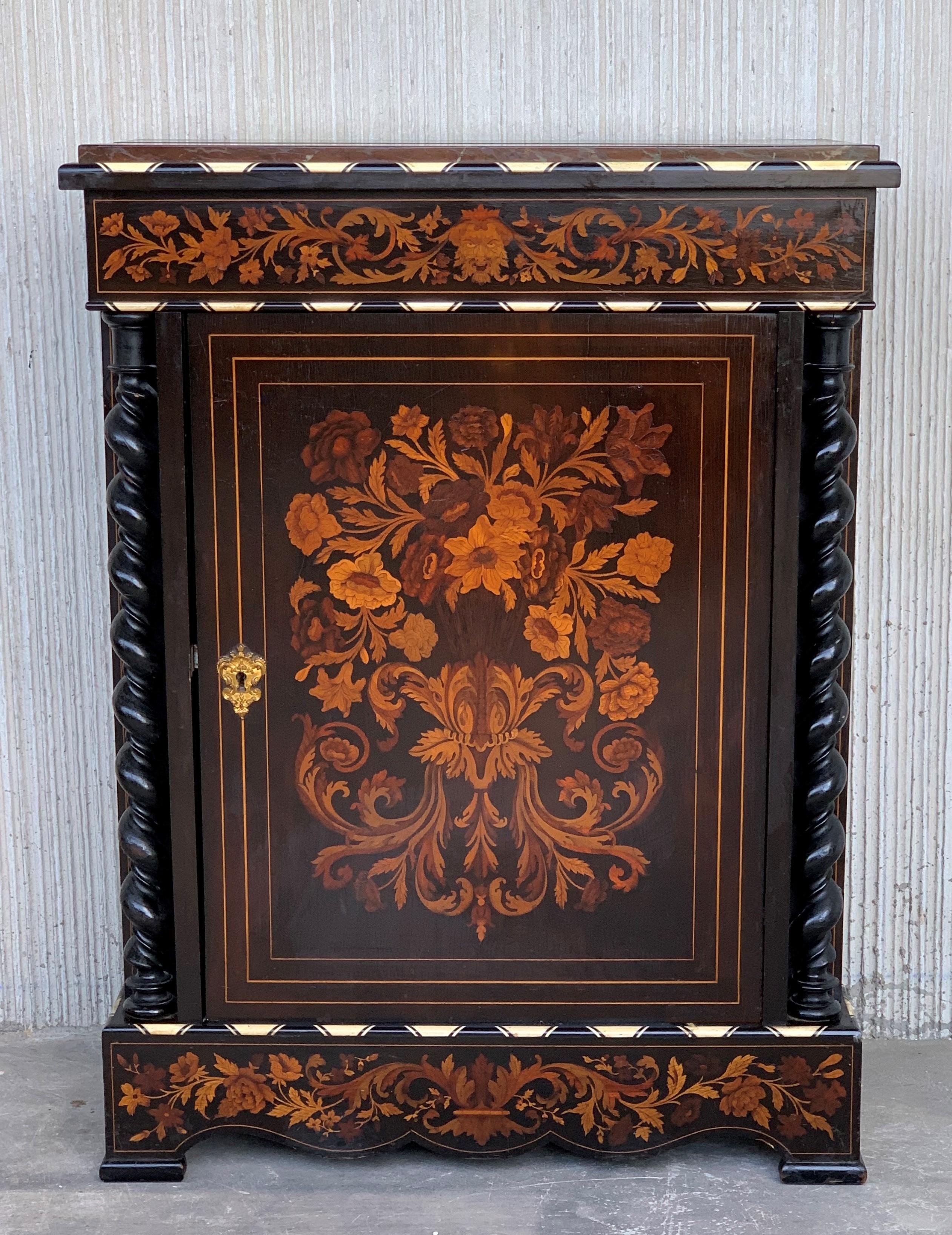 An exceptional cabinet or encoignures with a marble top above canted corners simulating fluting and solomonic colums in both sides, the panelled door with flowers in a vase made of precious woods i.e. burl ash, walnut, fruit woods, with pyrogravure