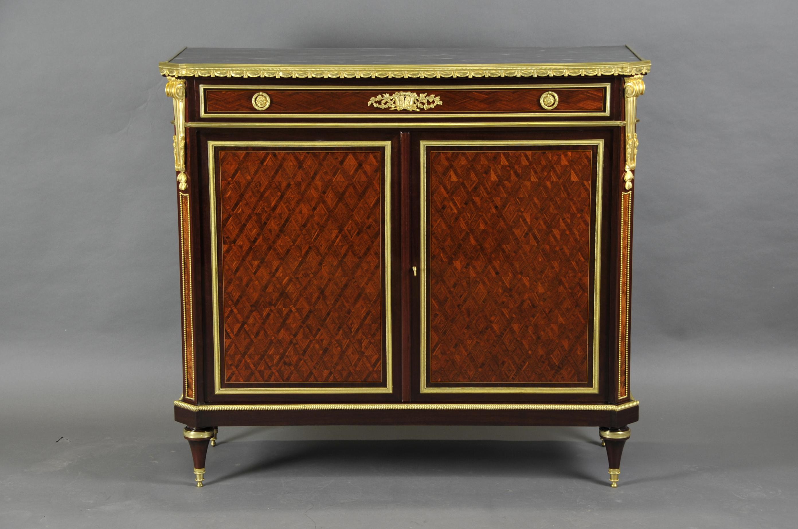 Elegant and refined Louis XVI meuble d'appui in trellis and diamond marquetry made of violet wood and rosewood in amaranth frames. Opening two doors and a drawer, topped with a blue turquin marble top and endowed with a magnificent ornamentation of
