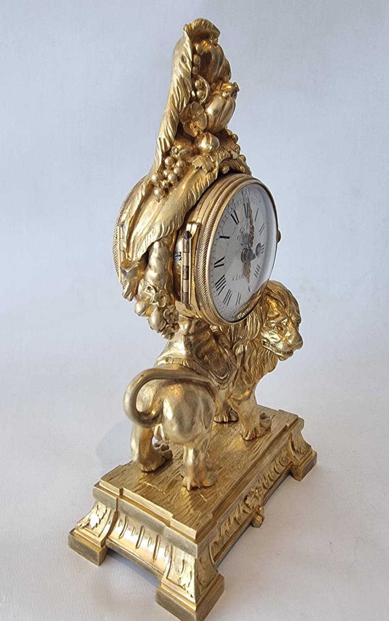 A rare 18th century to early 19th century Louis XVI miniature ormolu mantle or table clock depicting a lion. The piece is surprising heavy for such a small clock, which is always a sign of quality. The case stamped underneath Pajot. Antoine Philippe