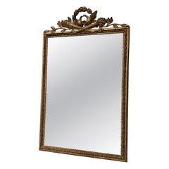 Louis XVI mirror in carved and gilded wood, 18th century