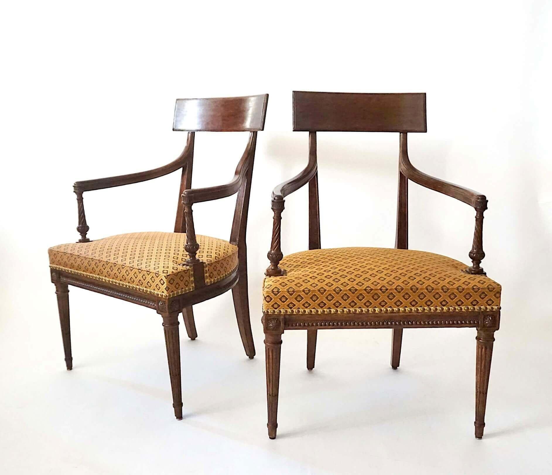 A fine pair of French, circa 1785, late Louis XVI fauteuils having tall tablet form backrests on channeled vertical supports issuing shaped arms ending in 'dolphin-nose' arm-rests above carved twist and foliate baluster form supports, the wide