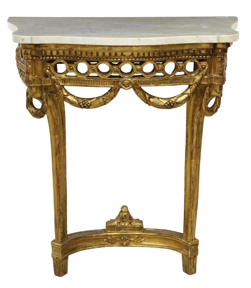 A stunning Louis XVI Neoclassical style wall-mounted console table

Circa early 20th century

Carved gilt wood, with white & gray marble top

Measures: 29.25
