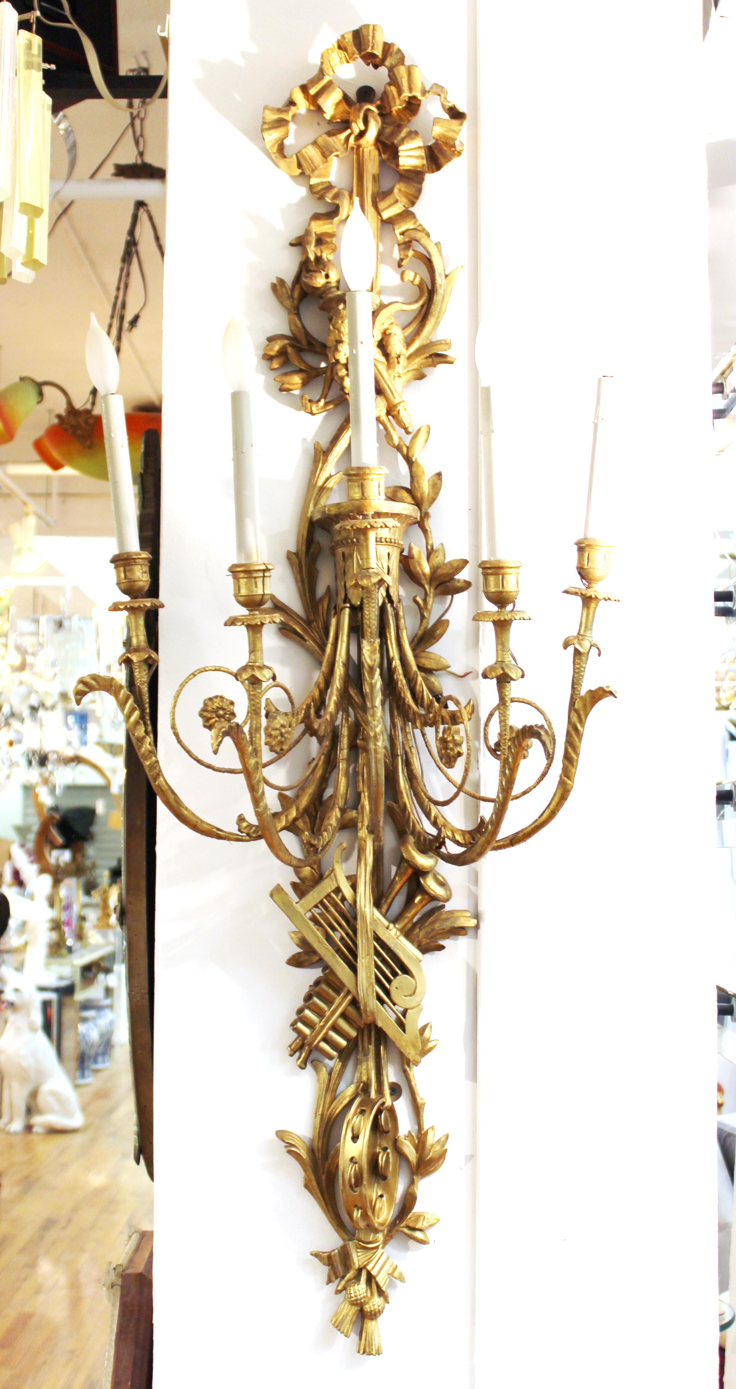 French Louis XVI Neoclassical Monumental Carved Giltwood Wall Sconces with Trophies