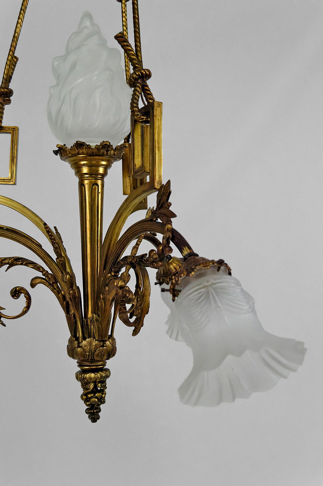 Bronze Louis XVI / Neoclassical style chandelier in gilded bronze, France, Circa 1900 For Sale