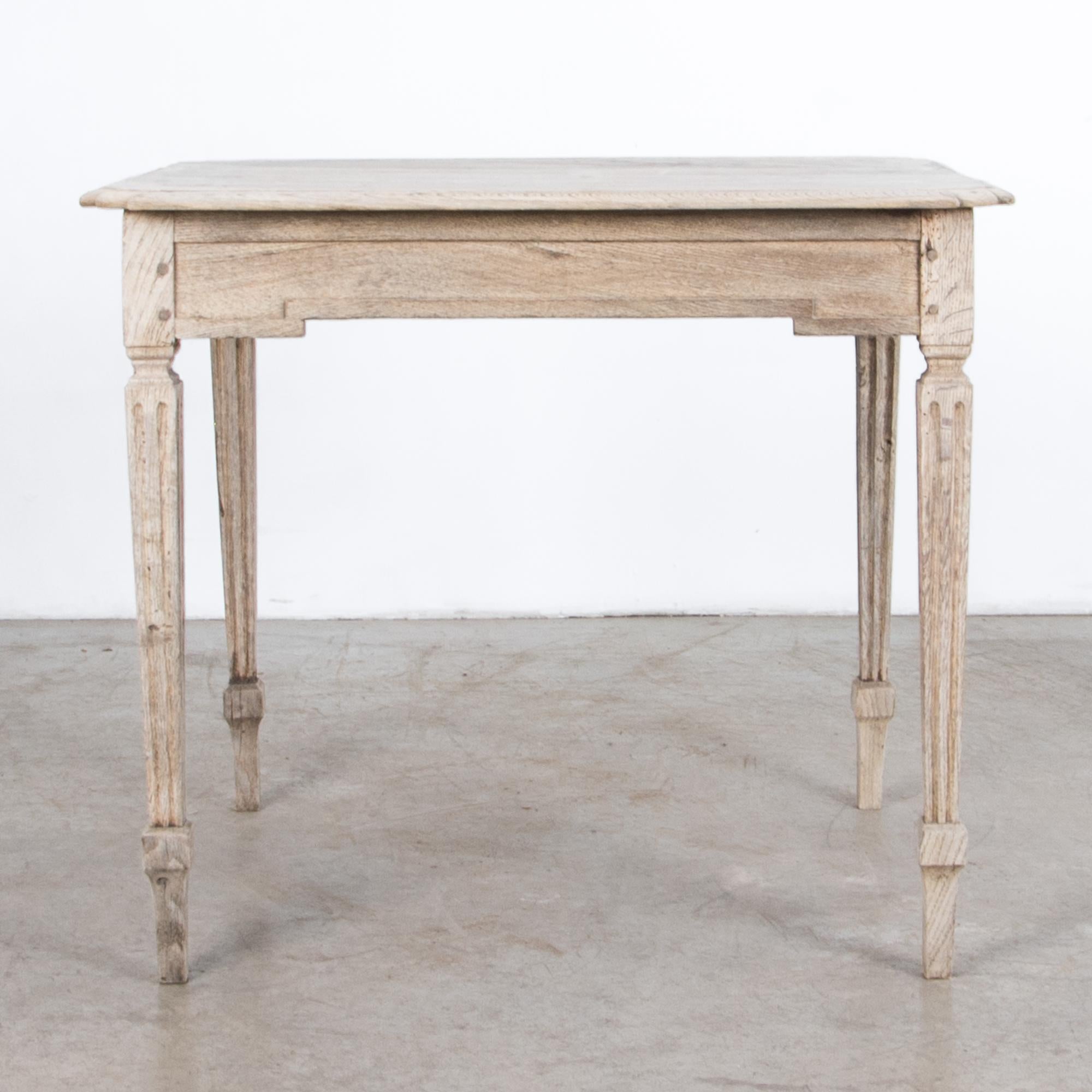 Carved with distinctive geometric motif in textured bleached oak, a square side table from France, circa 1880. Influenced by the formal Louis XVI, this piece looks casual in rustic clear finish, showing the worn patina and beautiful wood grain. A
